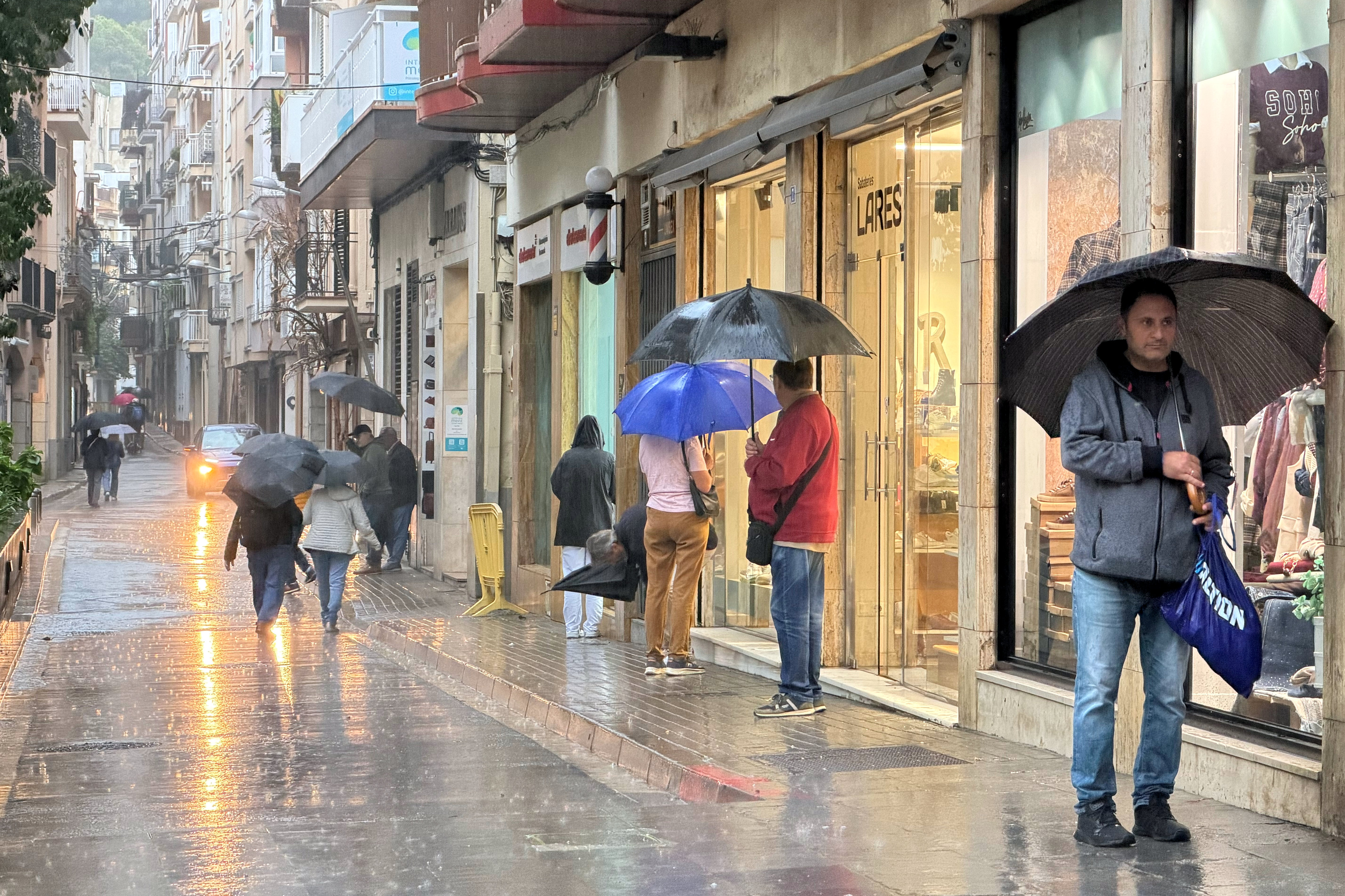 Rain in the Blanes shopping district.