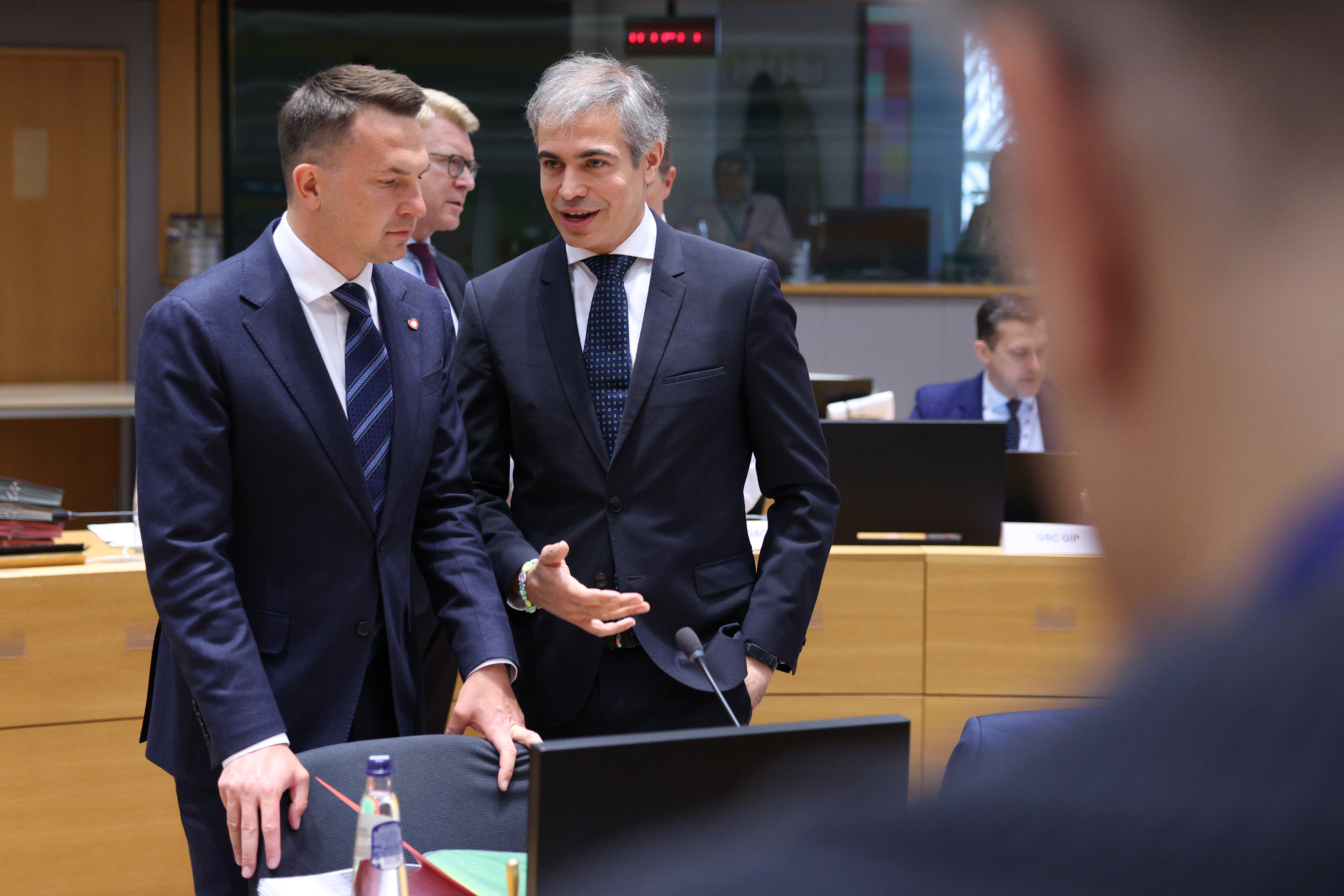Spanish Secretary of State for the EU Fernando Sampedro speaking with his Polish counterpart during a General Affairs Council meeting