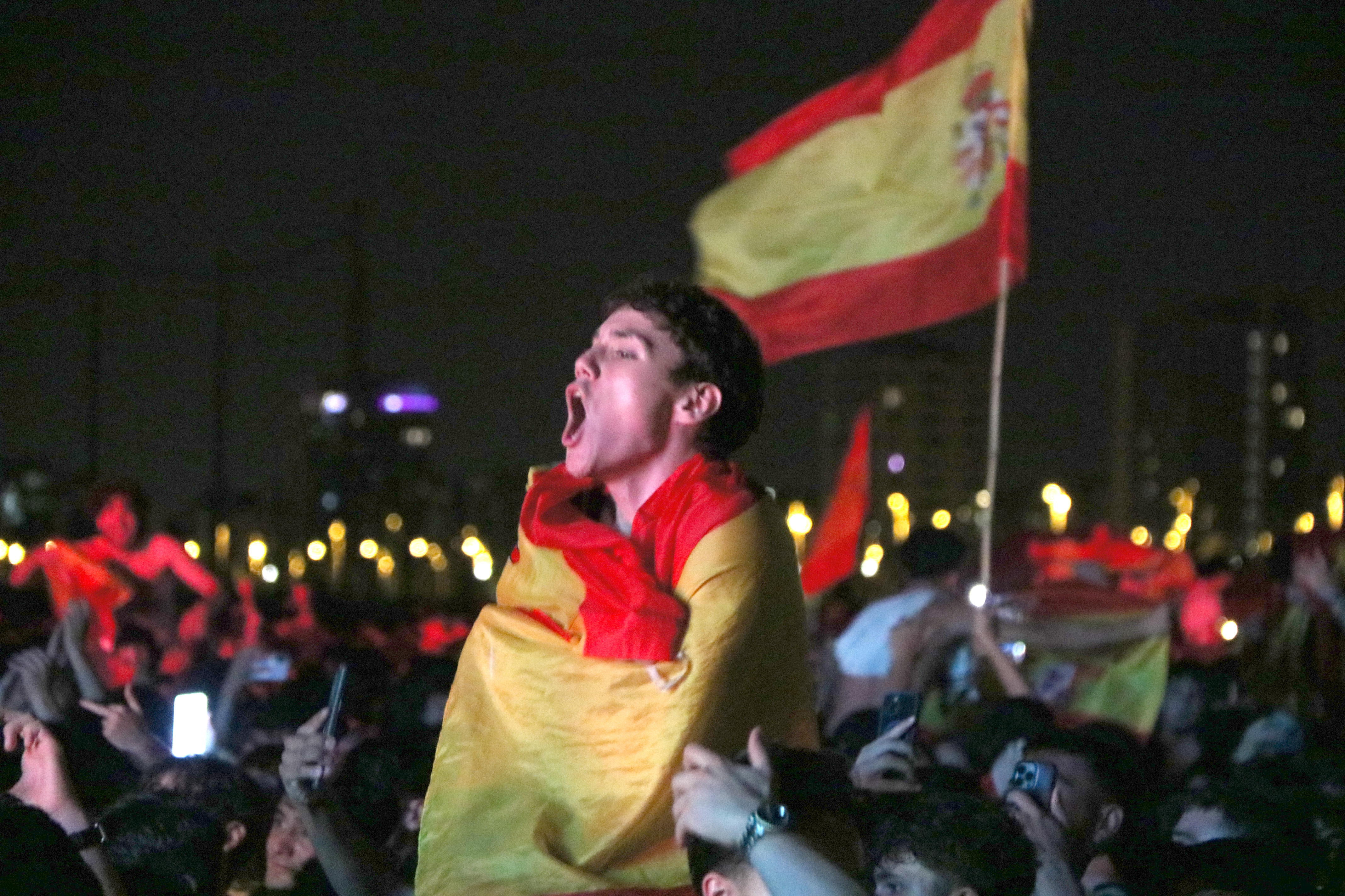Spanish fans celebrate victory in the men's World Cup final in Barcelona