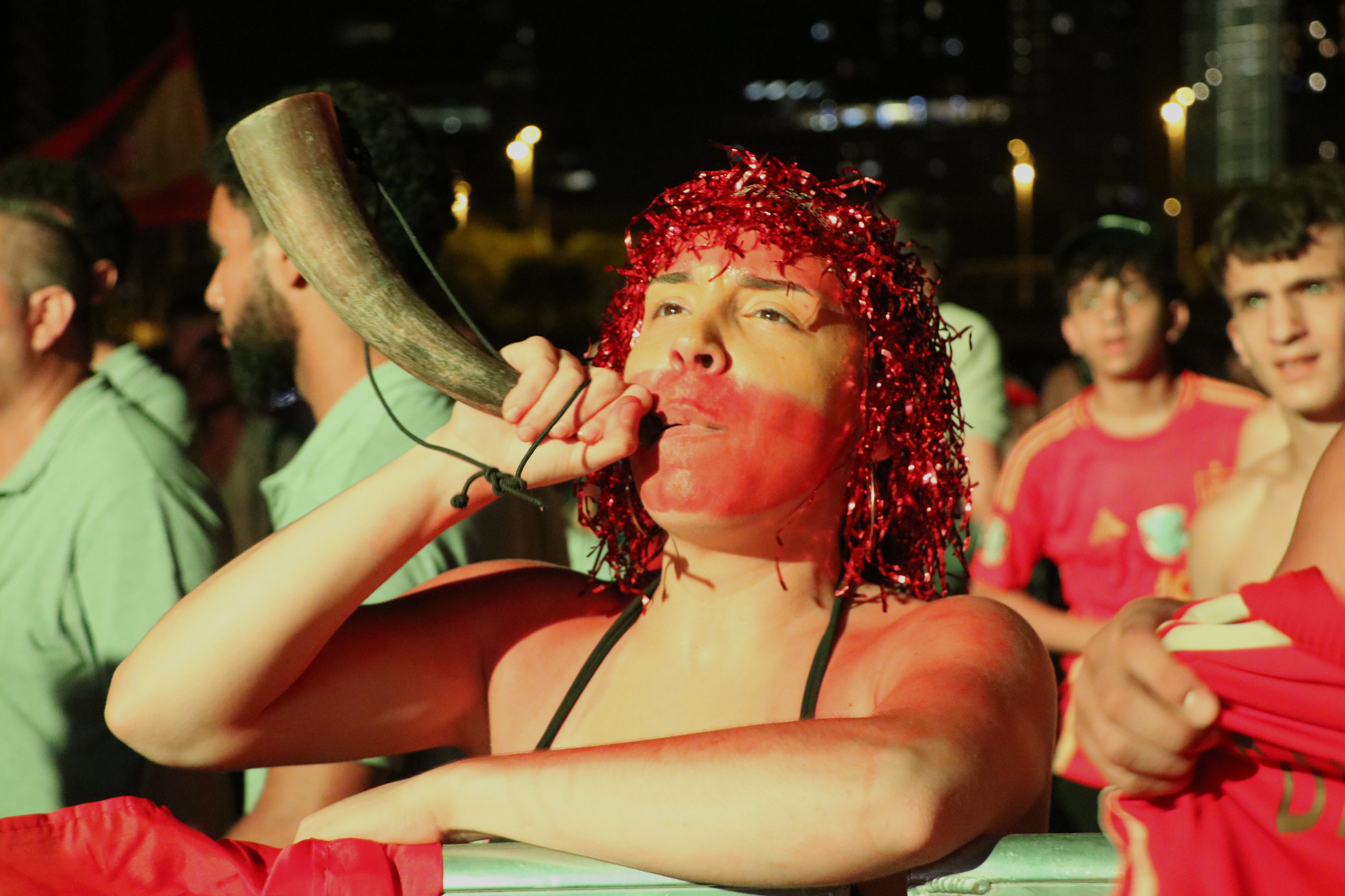 A Spanish fan with a horn celebrates victory in the men's World Cup final in Barcelona