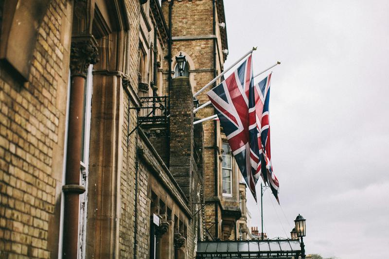 United Kingdom flags fly from a building