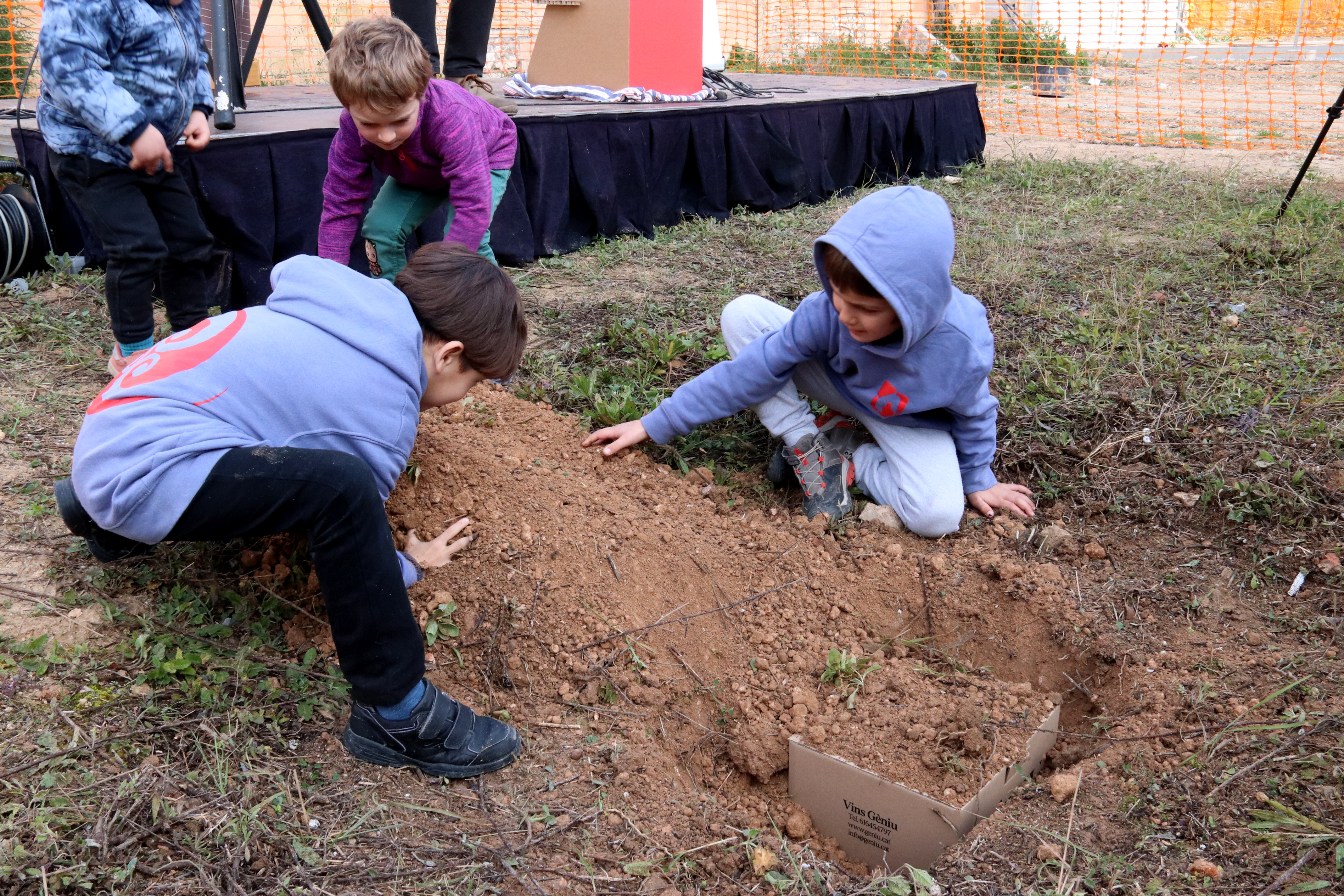 Children laying the foundation stone of the cooperative housing building