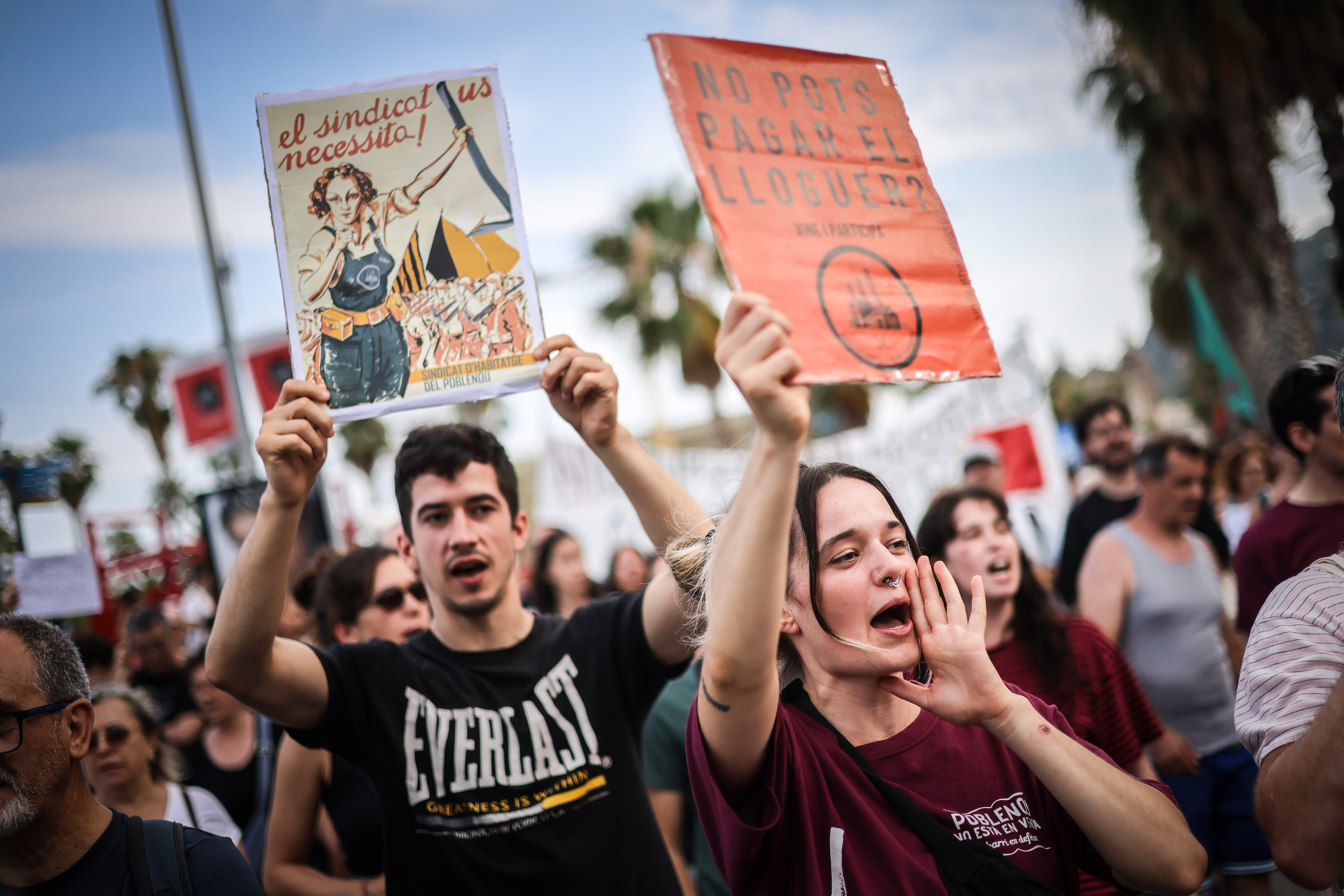 Some demonstrators against mass tourism holding posters during a rally on July 6, 2024