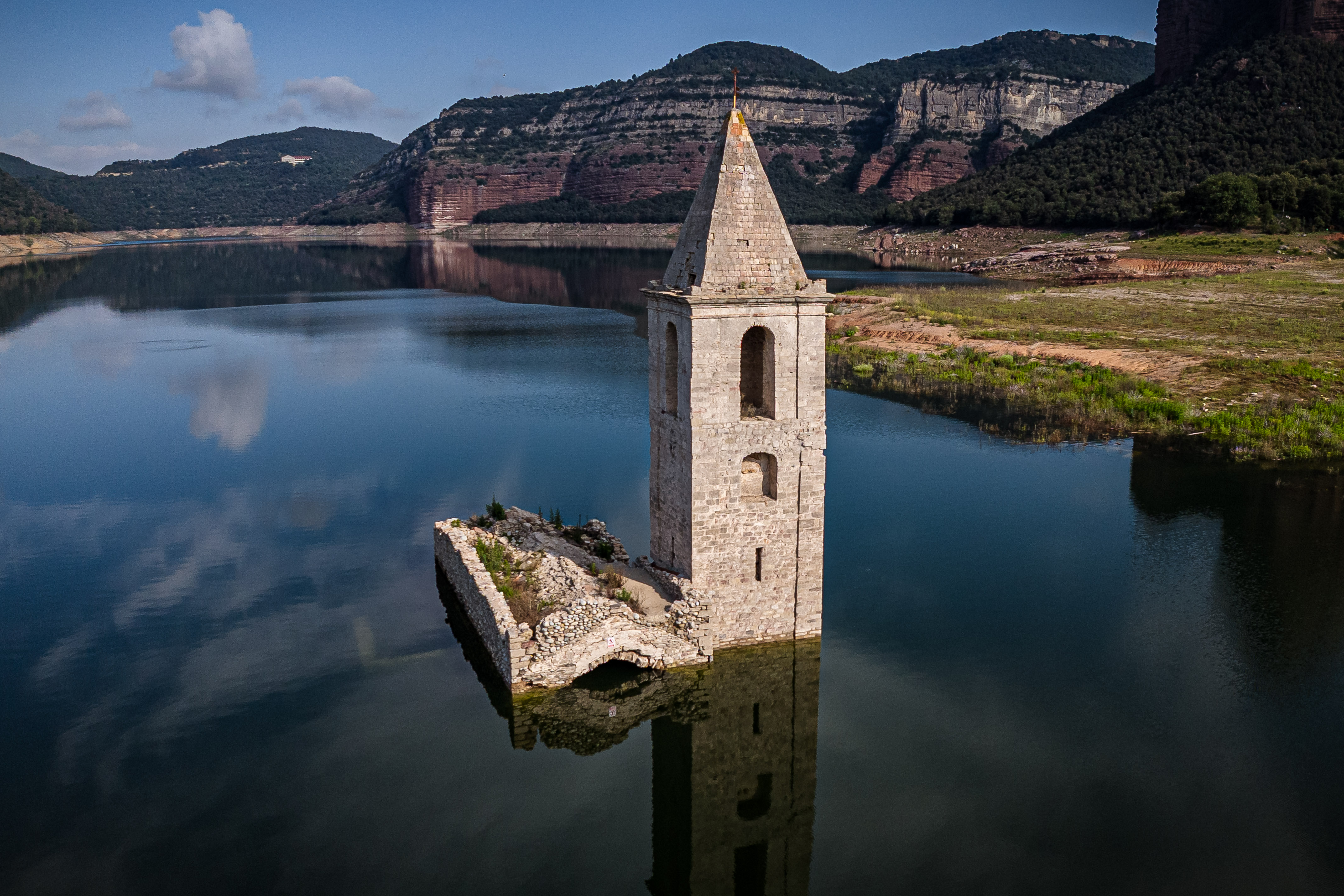 The Sant Romà de Sau church surrounded by water in the Sau reservoir, at 45% of its capacity on June 22, 2024