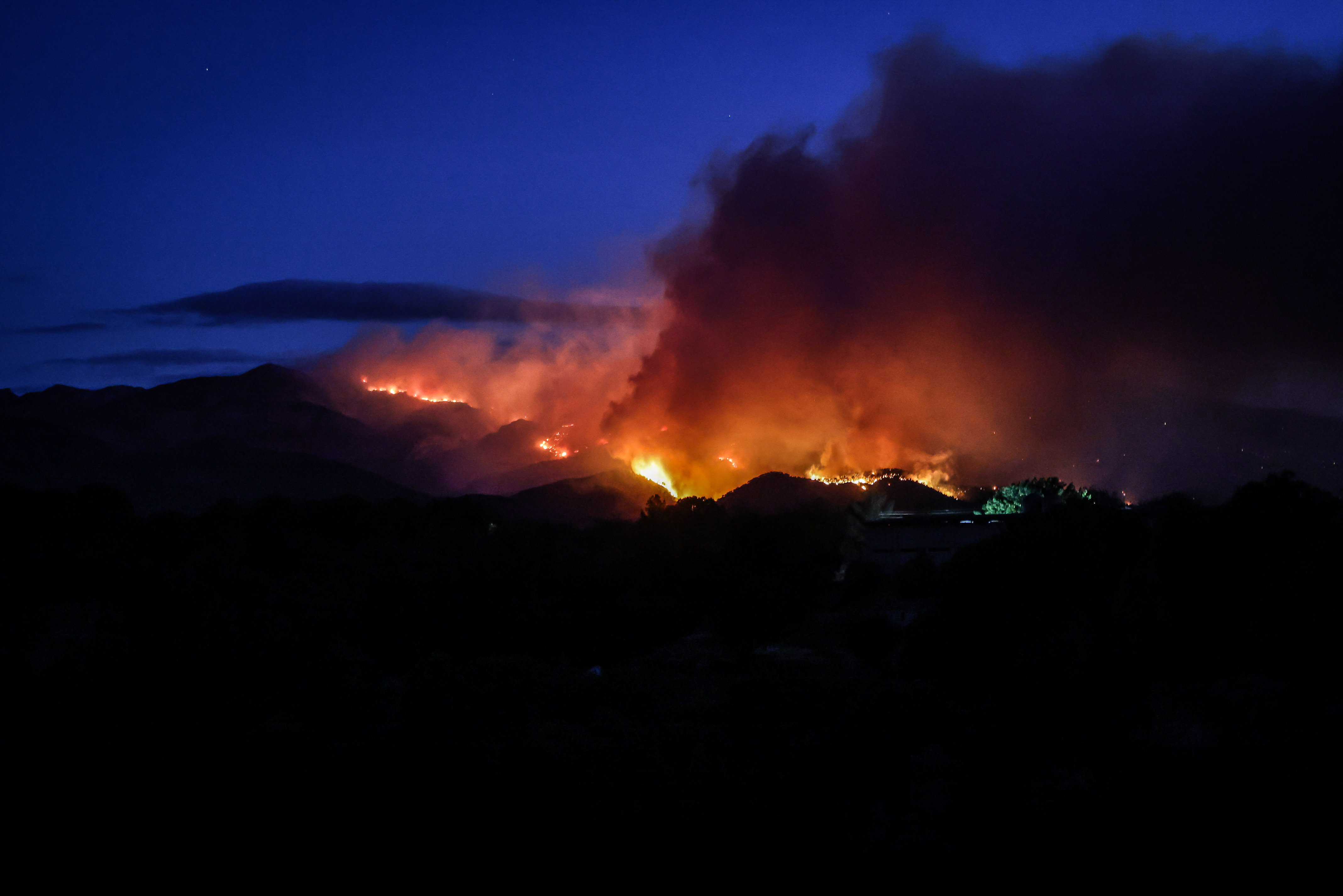 Flames of the Paüls wildfire affecting the Ports Natural Park in southern Catalonia