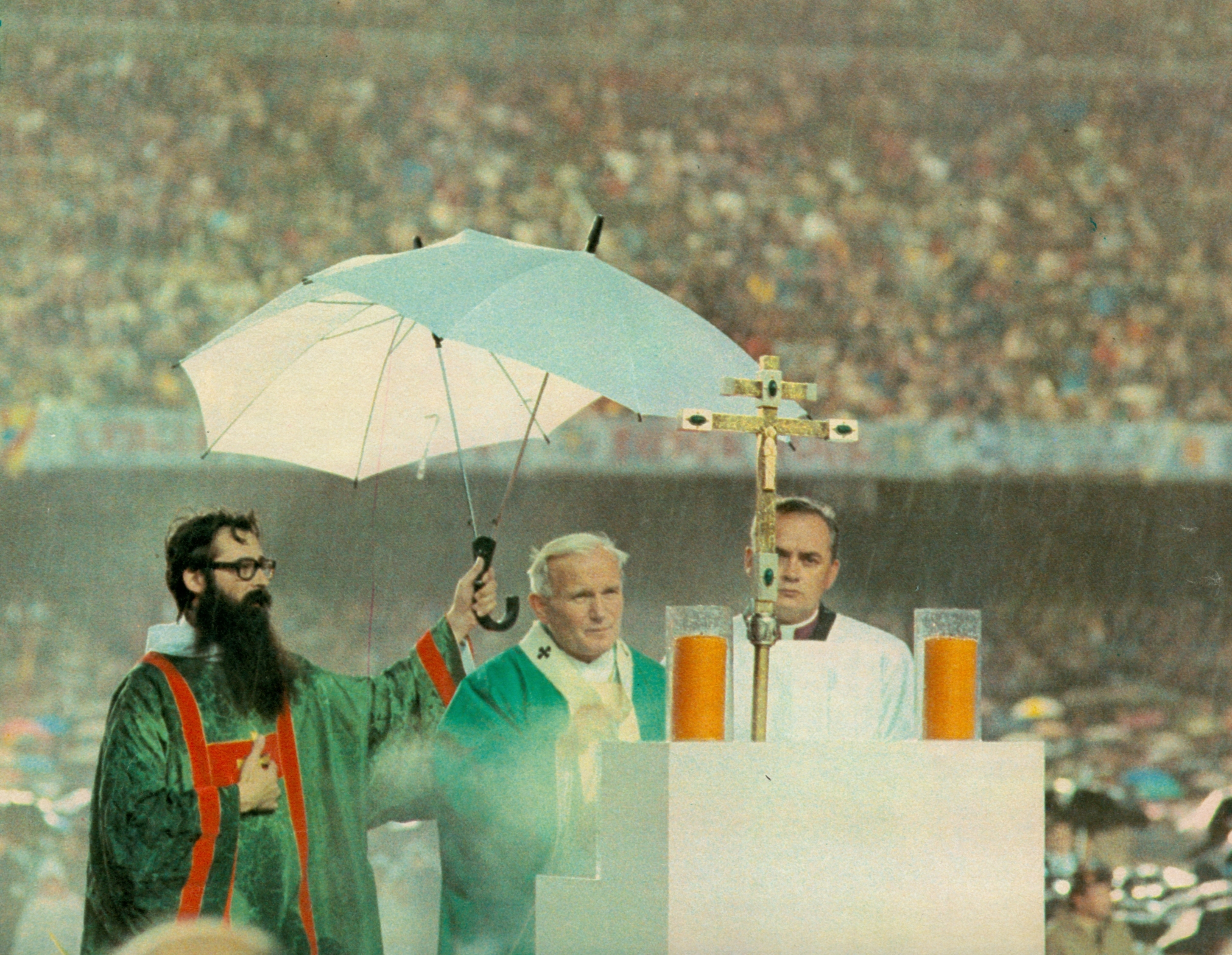 Pope John Paul II holds Sunday mass at Camp Nou under heavy rain in November 1982