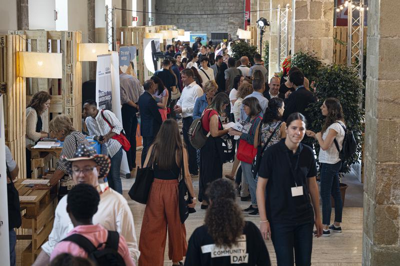 Attendees of the Barcelona International Community checking information from one of the stands installed