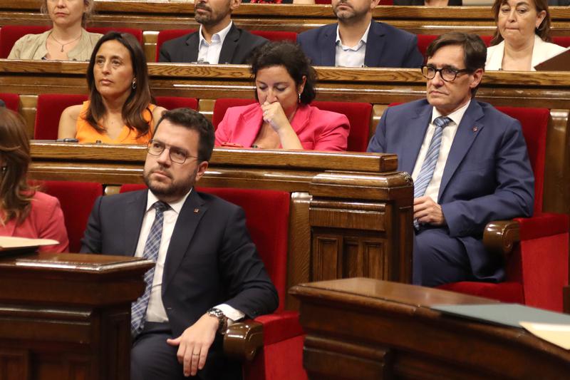 Sitting Catalan president Pere Aragonès sits in front of Socialist leader Salvador Illa in the Catalan parliament