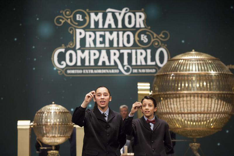 Students from San Ildefonso school in Madrid sing the lottery numbers in the Teatro Real