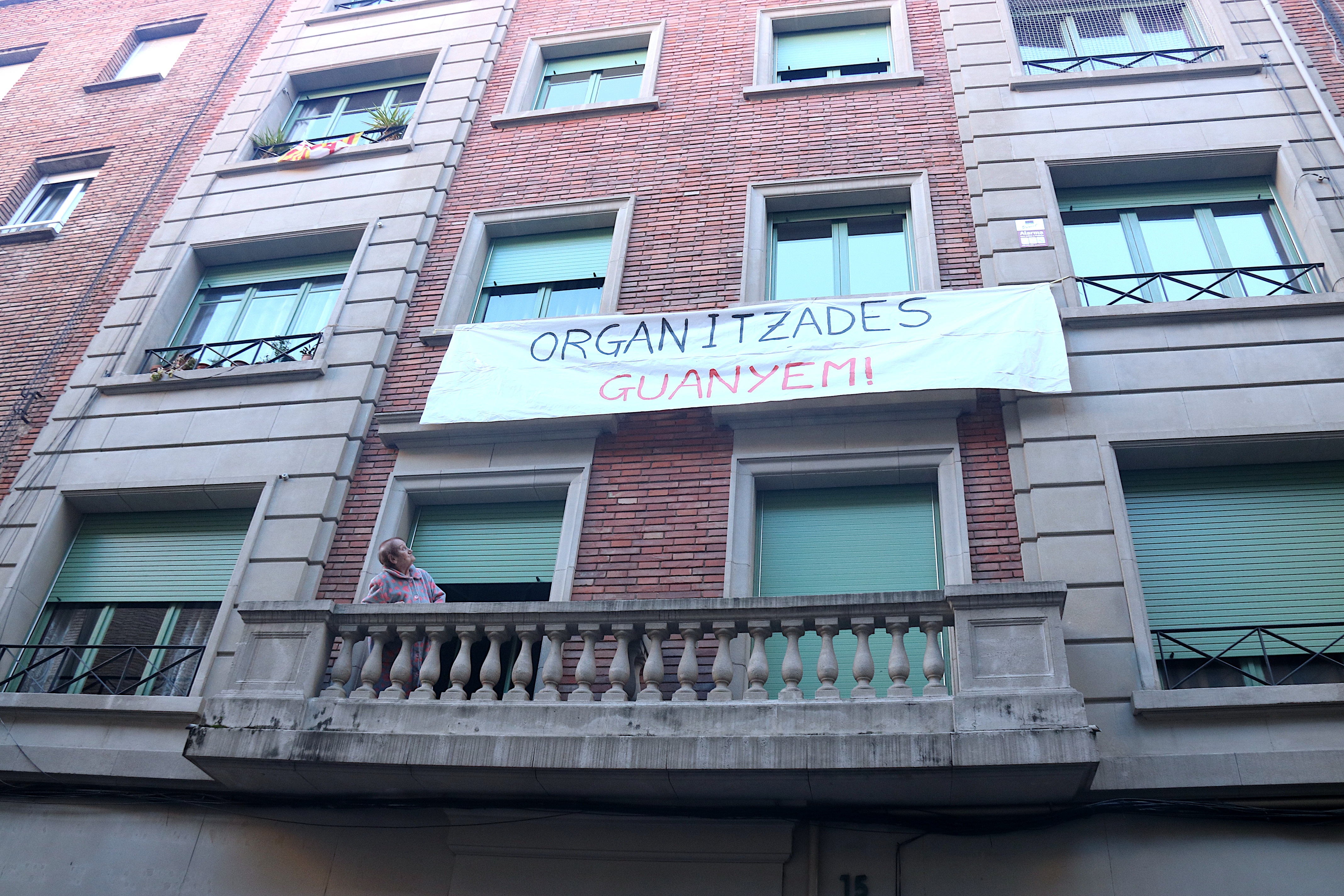 A sign in one of the affected buildings reads: "Organized, we win"