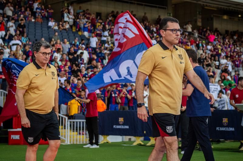 FC Barcelona doctor Carles Miñarro Garcia (right) walking in the Olympic Stadium in an archive picture