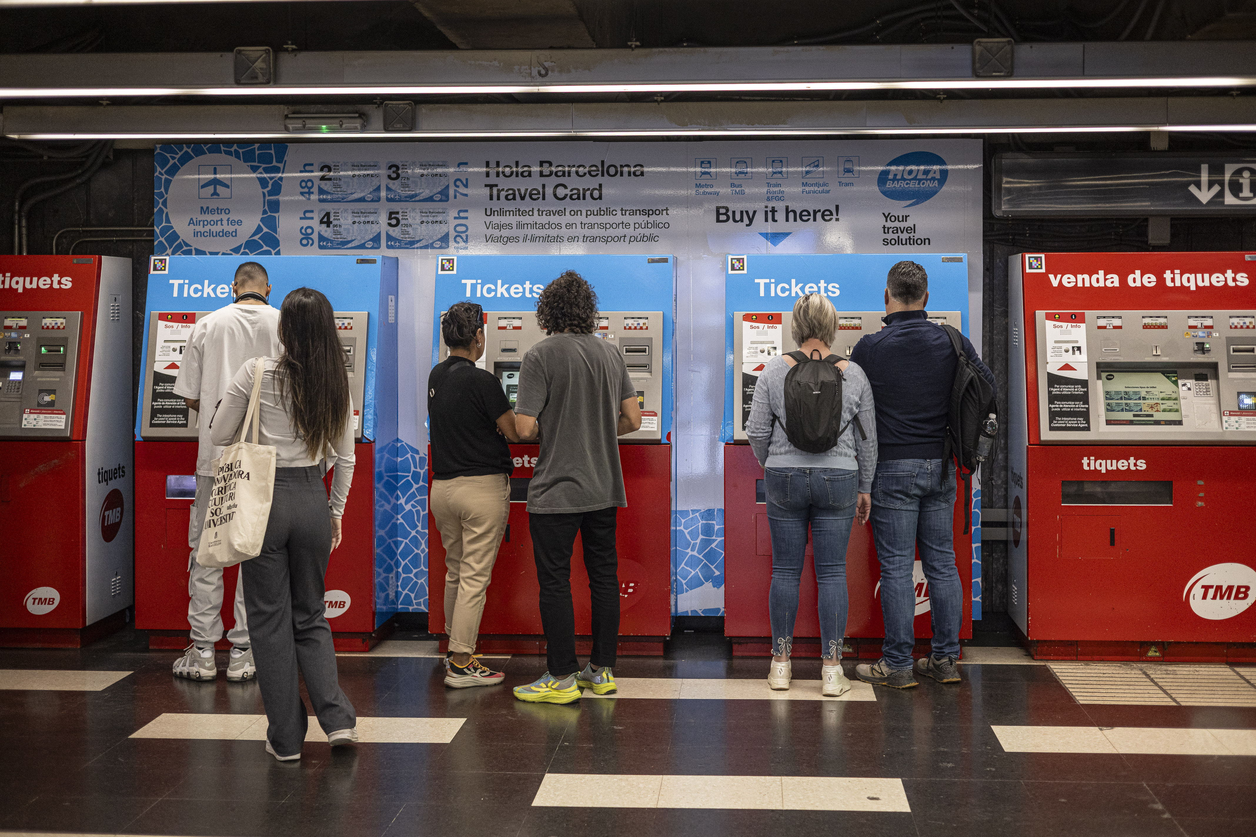 Passengers buying tickets for the Barcelona metro