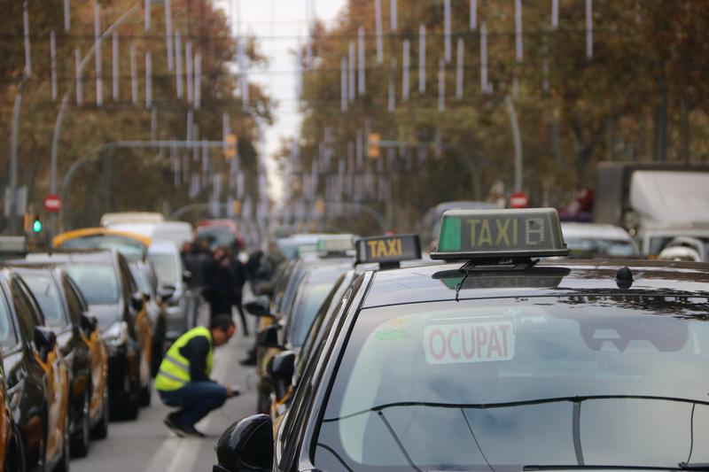 Dozens of taxis stopped at Barcelona's Gran Via boulevard during a strike on December 9, 2025