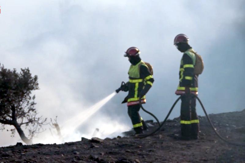 Two firefighters during the Portbou wildfire on August 4, 2023