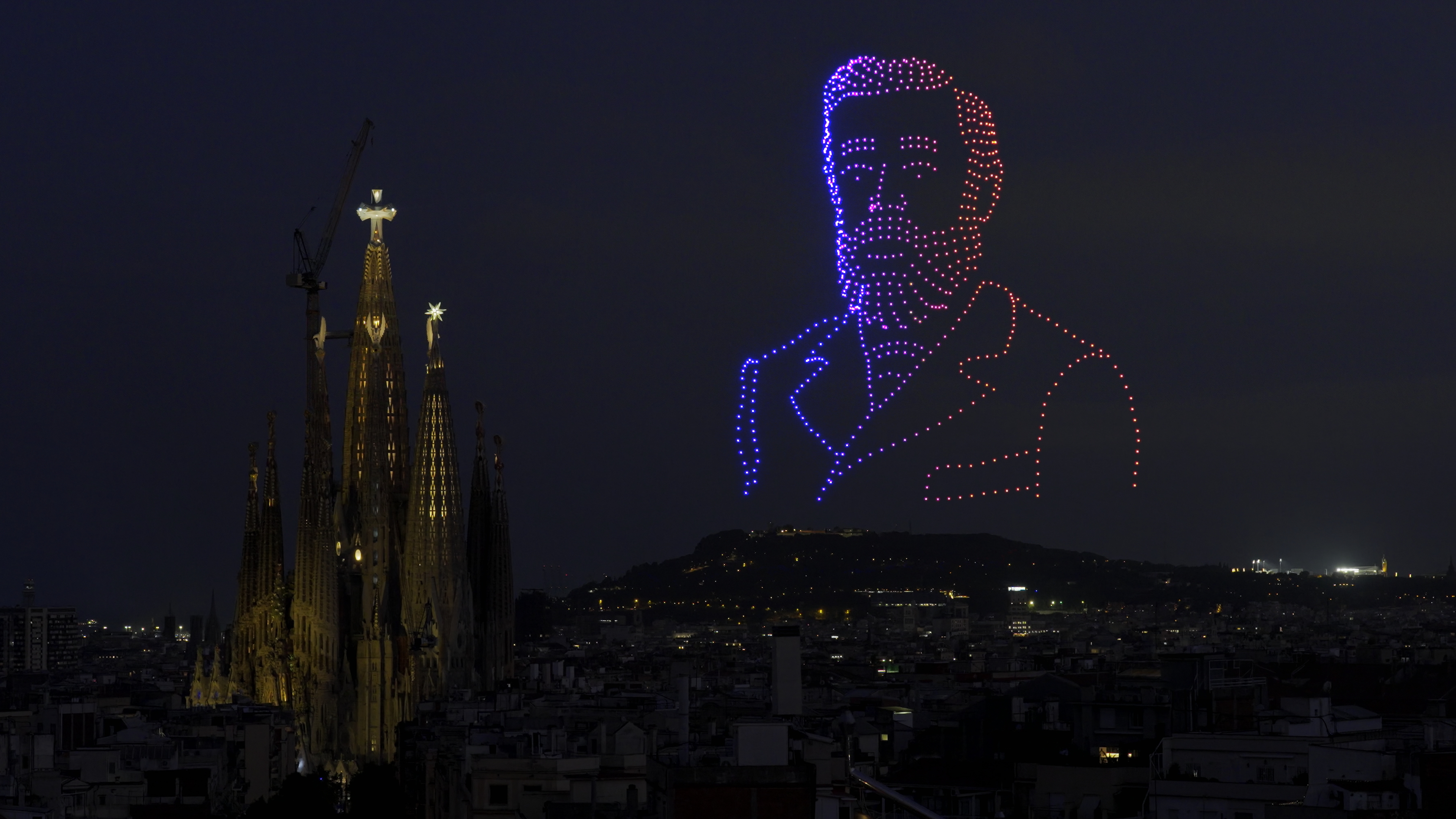 Antoni Gaudí's face formed by drones in the Barcelona sky beside the Sagrada Família during the Pope's blessing of the Tower of Jesus