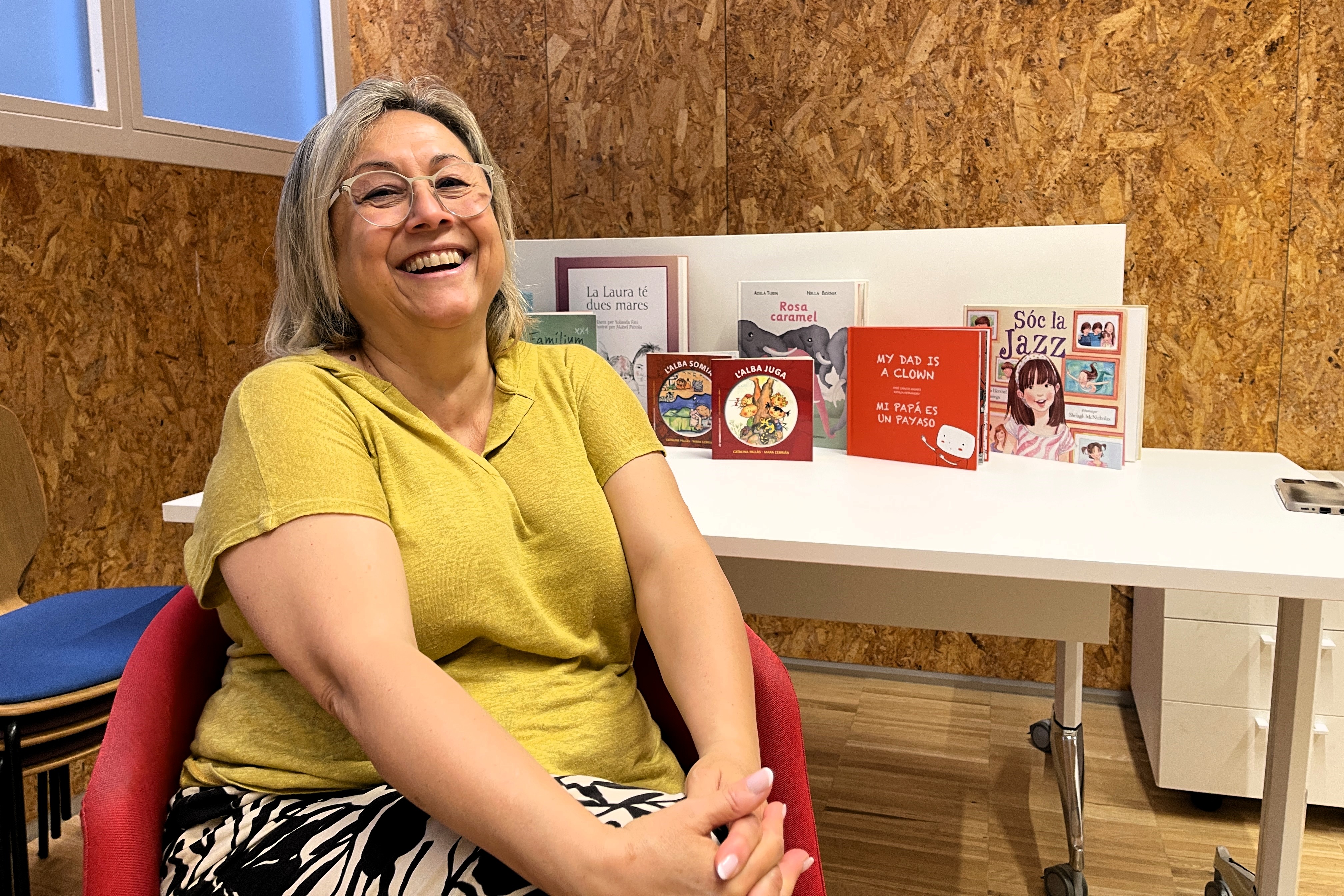 Teacher Katy Pallàs smiles at the camera during an interview with Catalan News