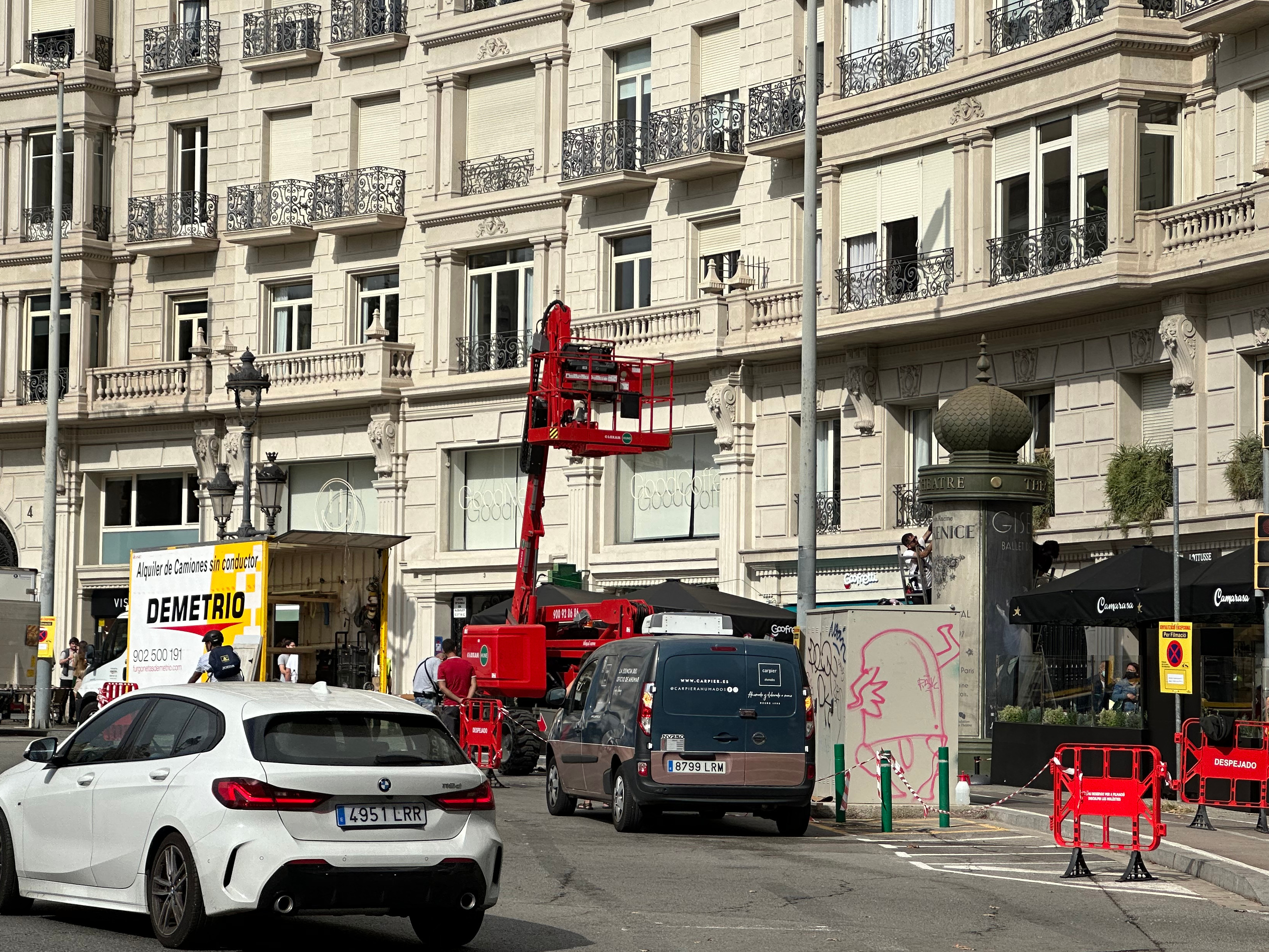 Crew members setting up elements of the 'The Crown' shoot in Francesc Macià square in Barcelona