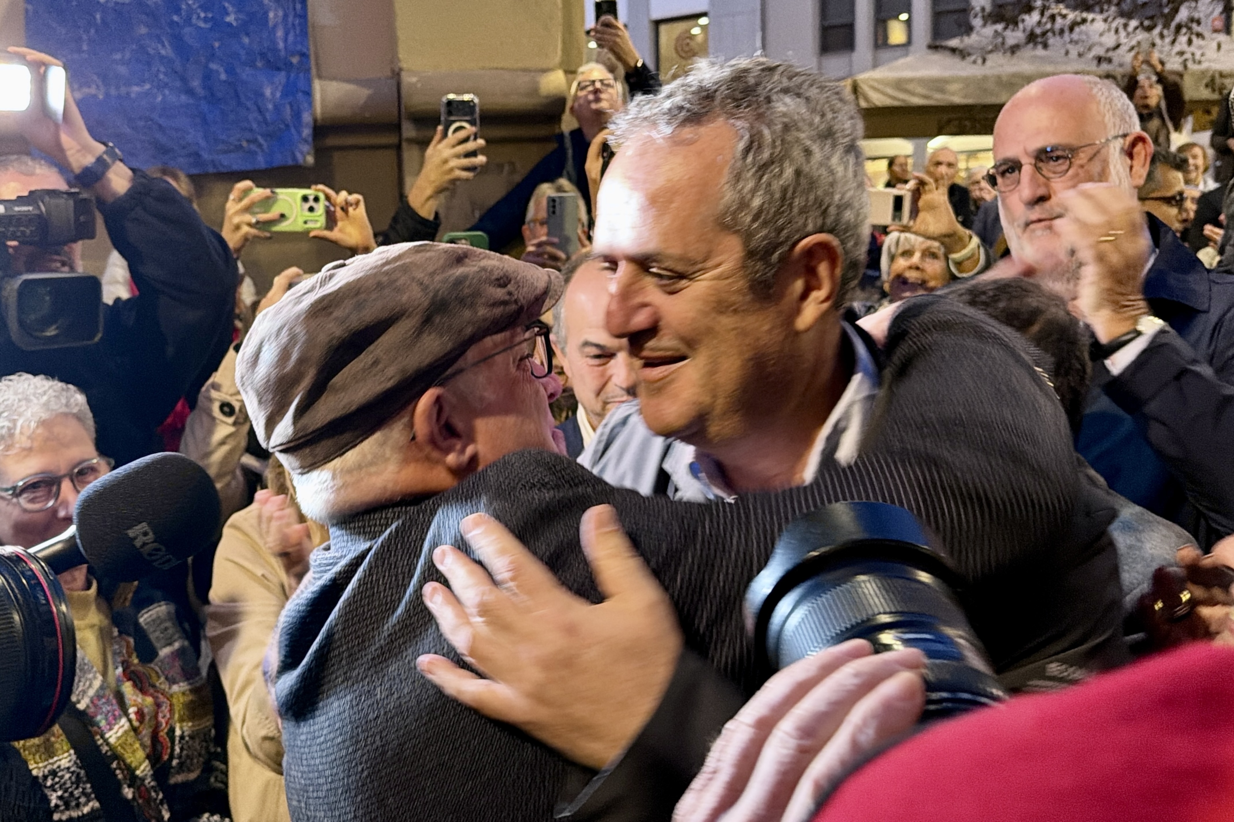 Lluís Puig greets fellow former minister Joaquim Forn in Terrassa