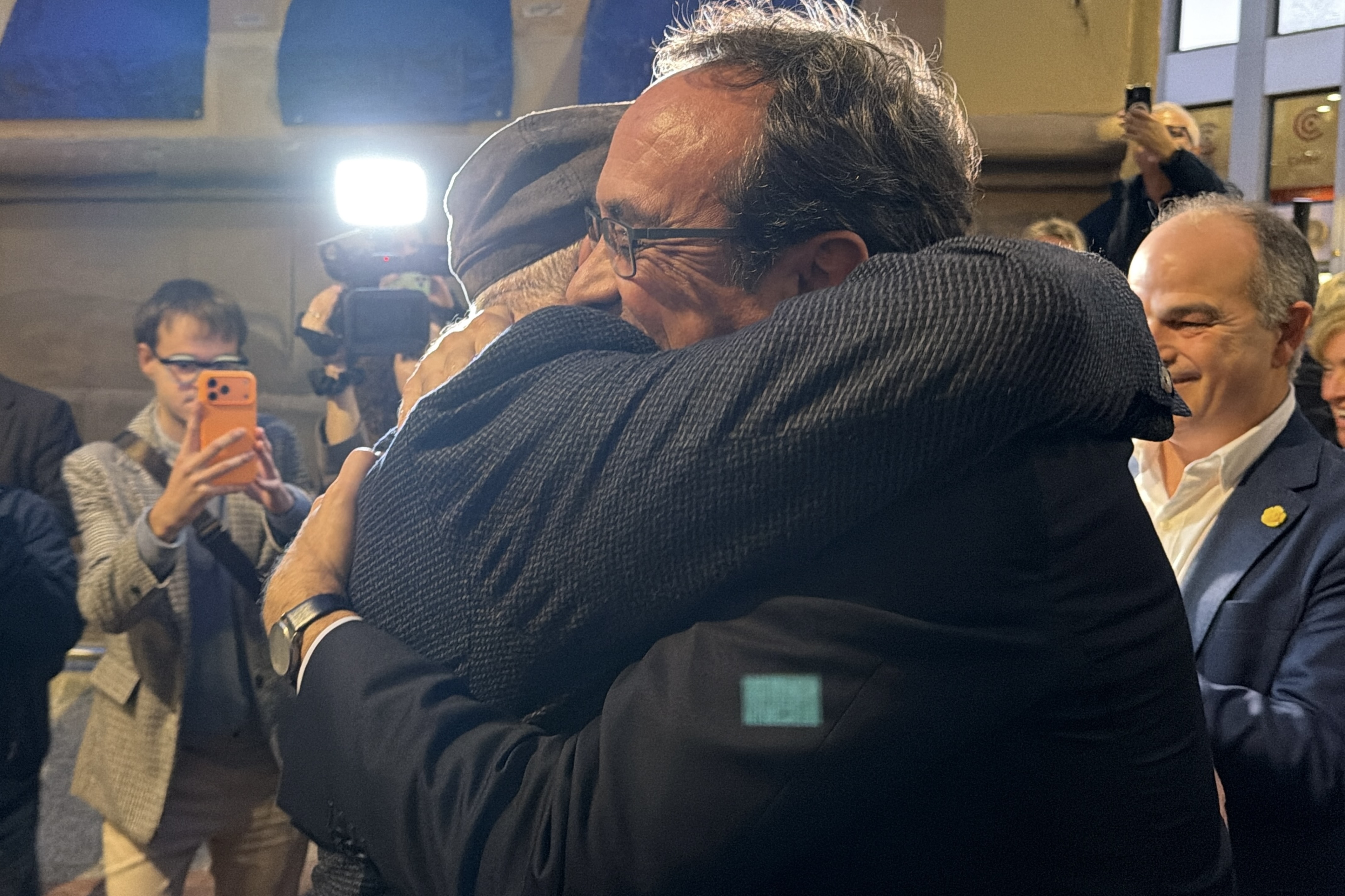 Lluís Puig and Josep Rull embrace