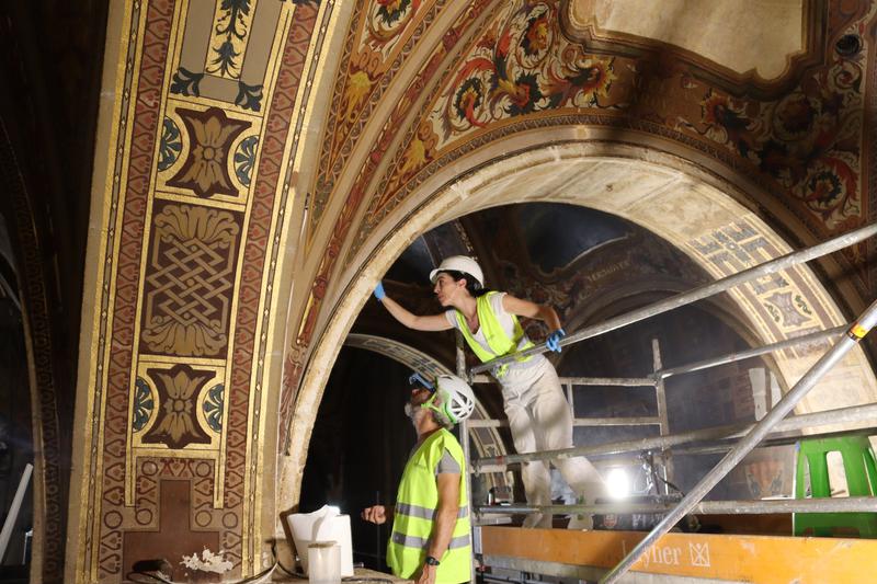 Workers uncovering Renaissance paintings in the Saló Sant Jordi room of the Catalan government headquarters building