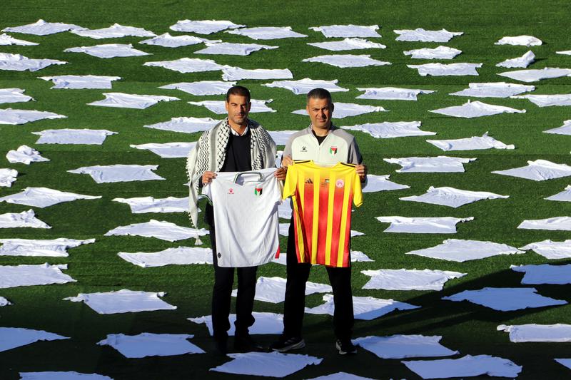 Catalonia’s national team coach Gerard López and Palestine’s national team coach Ihab Abu Jazar during the presentation of the Catalonia–Palestine match at Barcelona’s Olympic Stadium