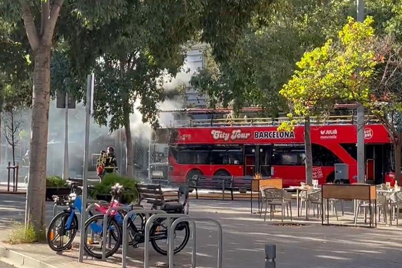 Screenshot of a social media video of a Barcelona tourist bus on flames