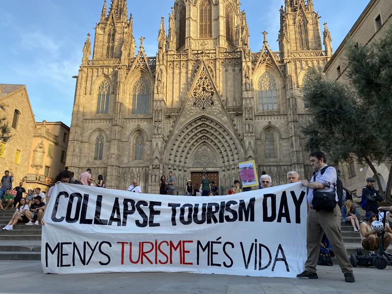 Residents demonstrate in front of Barcelona's Cathedral against mass tourism on September 27, 2023 coinciding with World Tourism Day