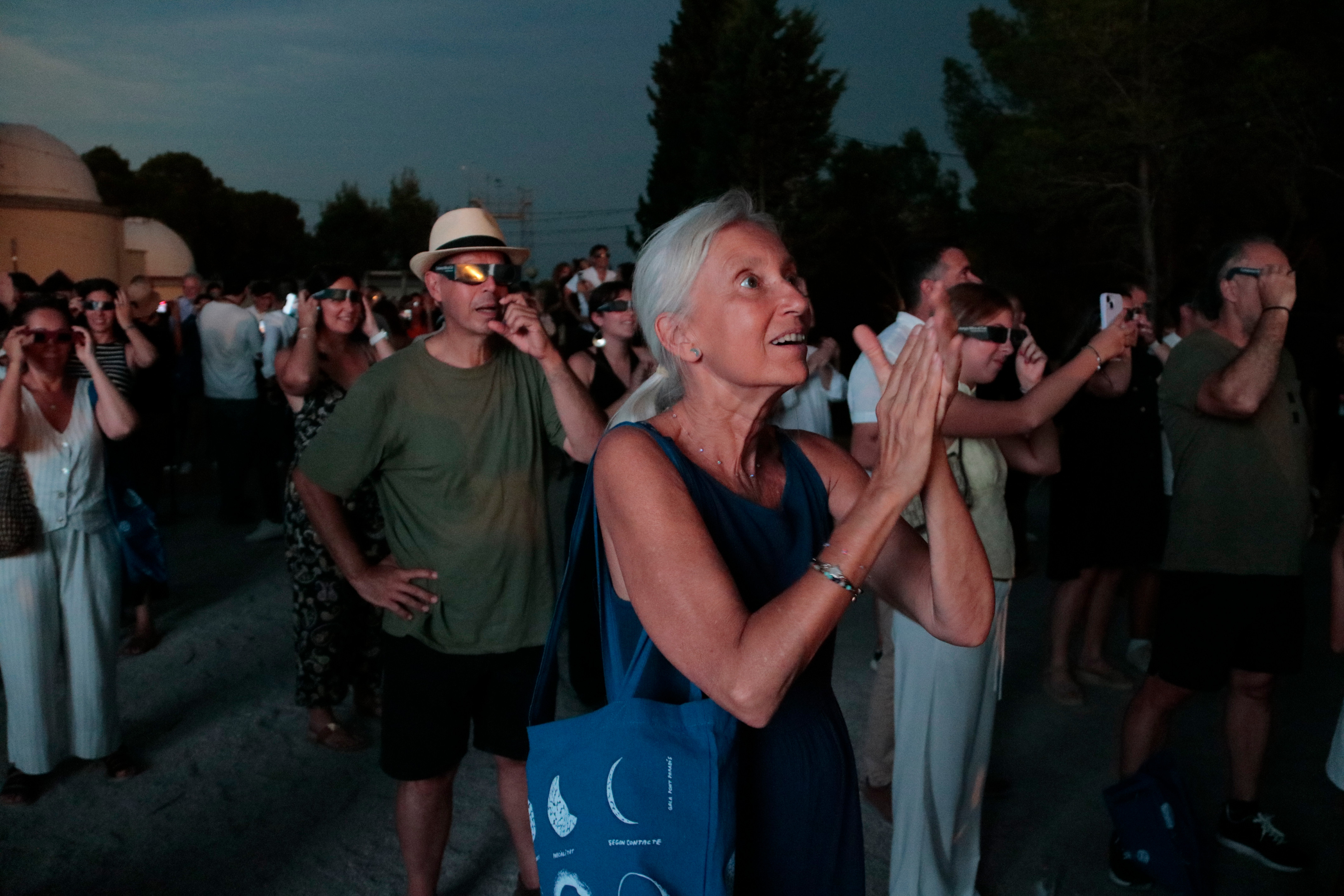 A woman gazes in awe at the total solar eclipse at the Ebre Observatory in Roquetes
