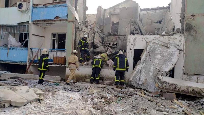 Ukraine's emergency team working in Kharkiv after a bomb blasted a building on March 12, 2022