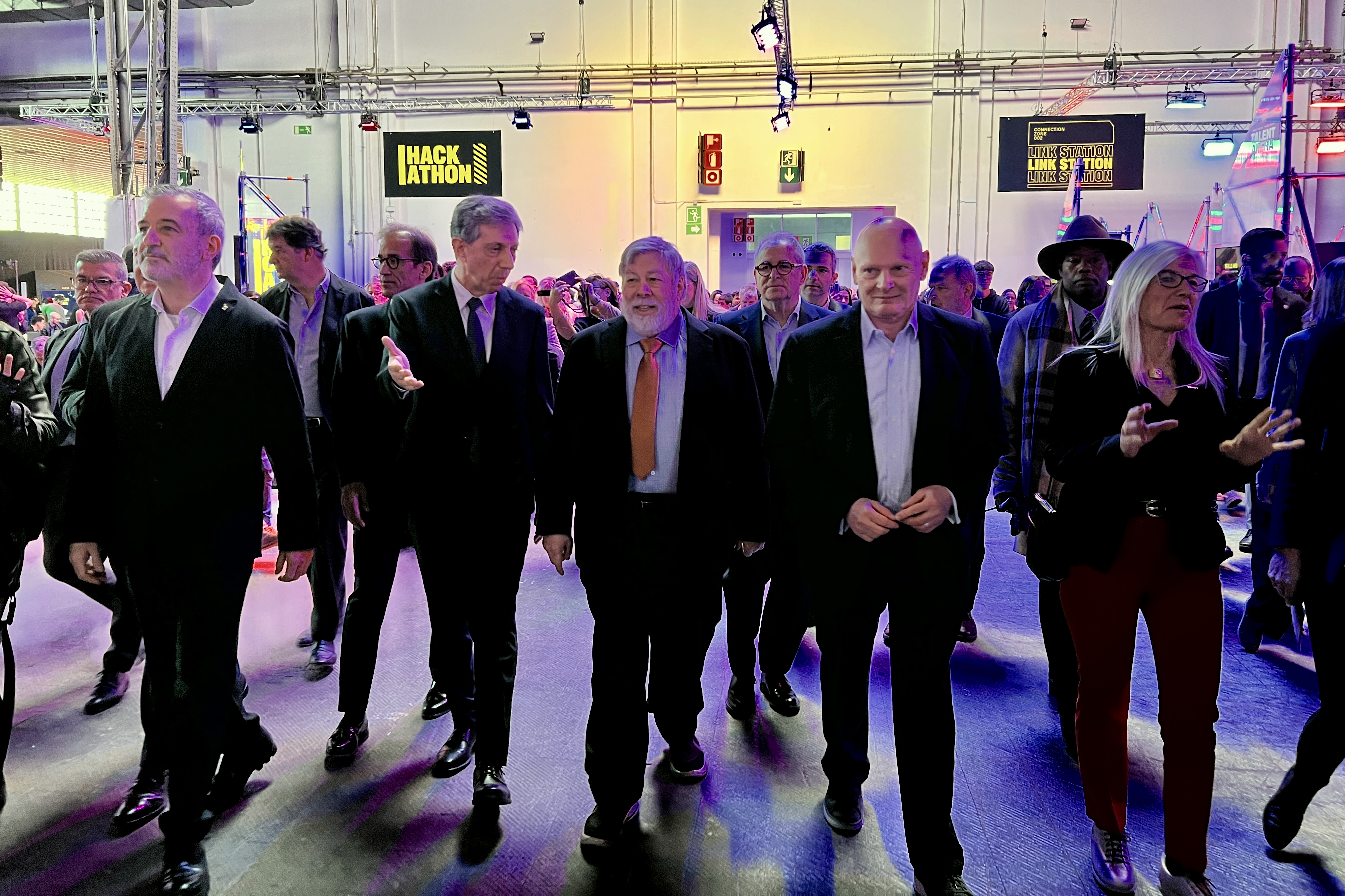 Steve Wozniak, Apple co-founder, walks around the Talent Arena fair accompanied by GSMA CEO John Hoffman, and Barcelona mayor Jaume Collboni on March 4, 2025