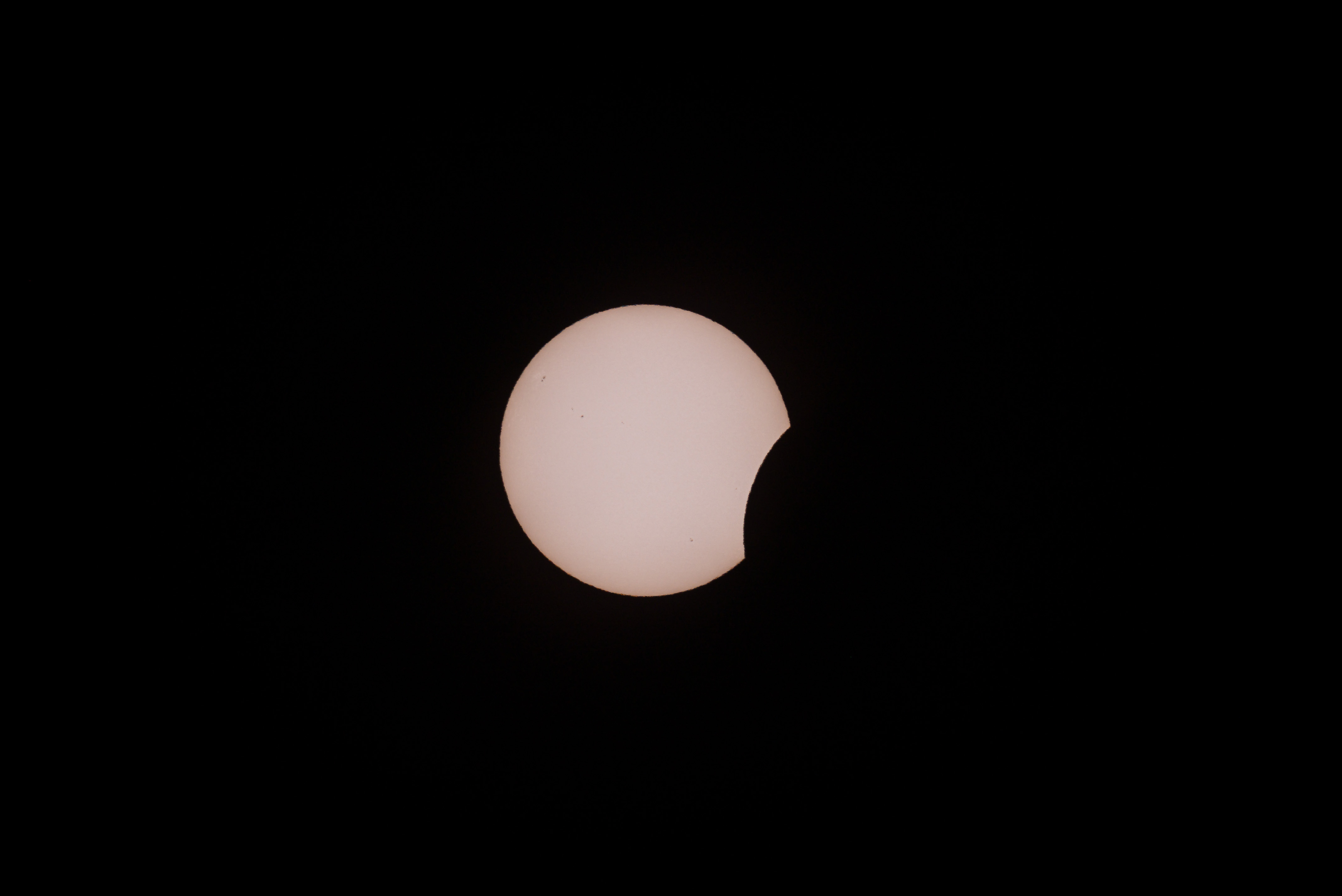 The beginning of the solar eclipse in La Granadella, with the Moon slightly obscuring the Sun