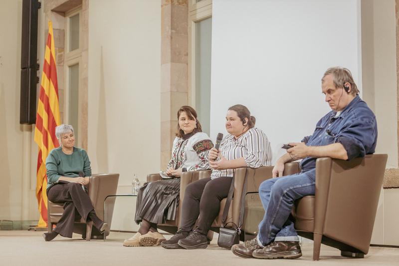 Human rights activists Oleksandra Romantsova, Natallia Satsunkevich, and Alexander Cherkasov photographed during the Catalan parliament's first peace conference, January 30, 2023