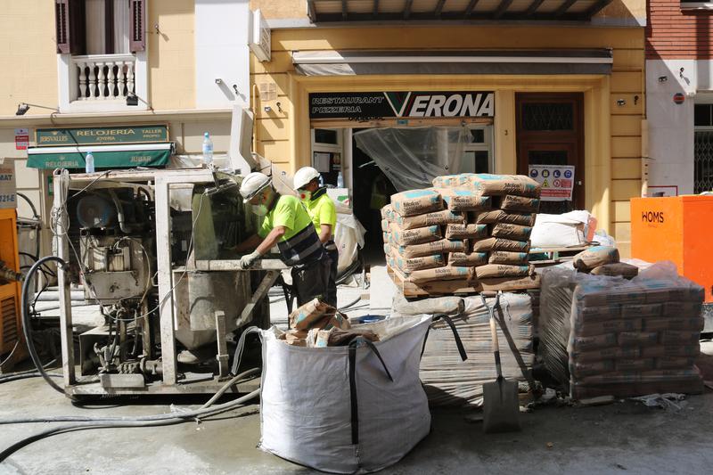 Workers working on one of the buildings affected by the L9 sinkhole.