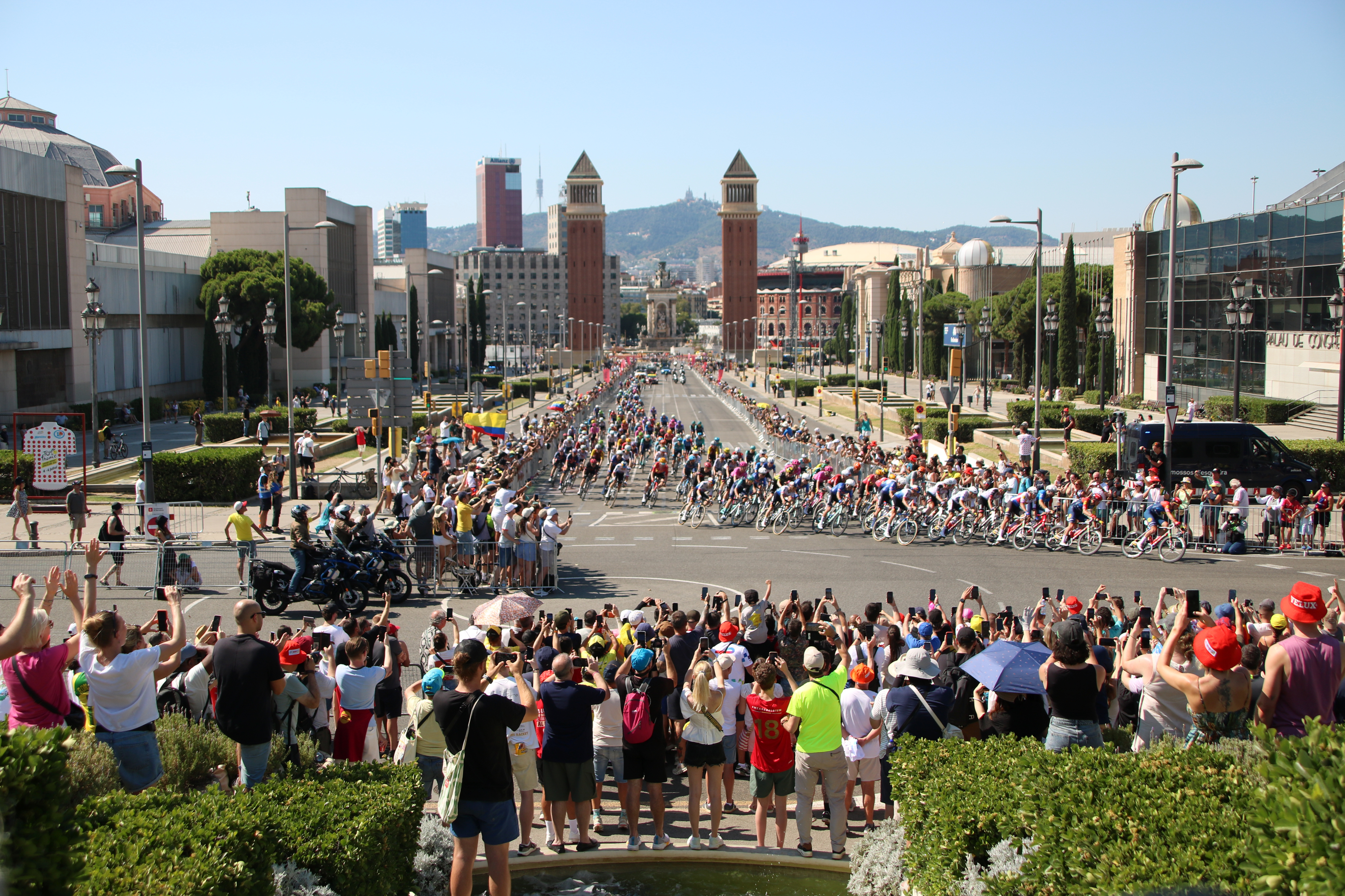 Fans welcome the cyclists arriving at final stretch of stage two of the Tour in Montjuïc