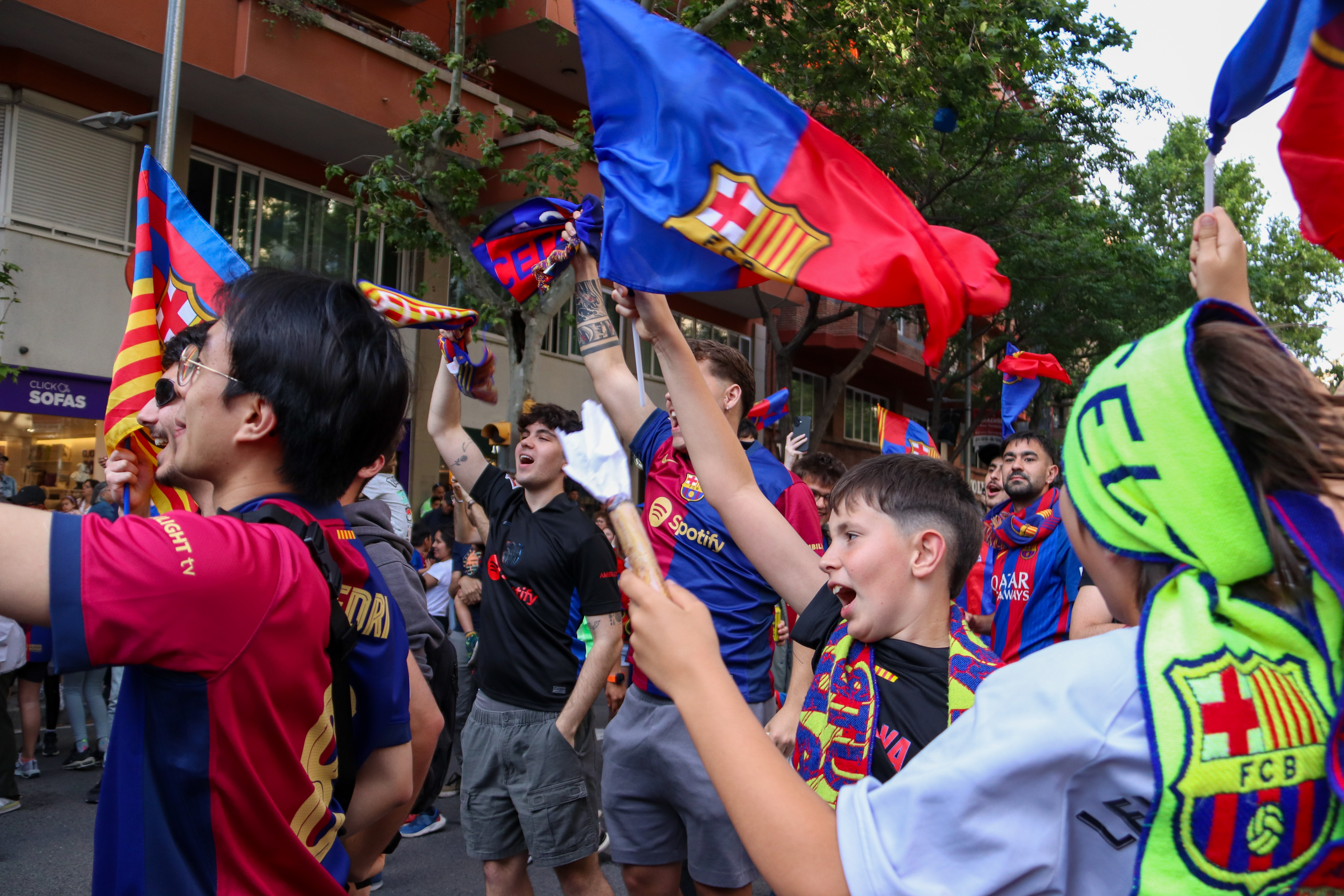 FC Barcelona fans celebrating during the parade for the club's 2024/25 La Liga and Copa del Rey titles