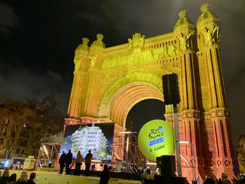 Arc de Triomf in yellow light at the 100-day party until the Tour De France kicks off from Barcelona