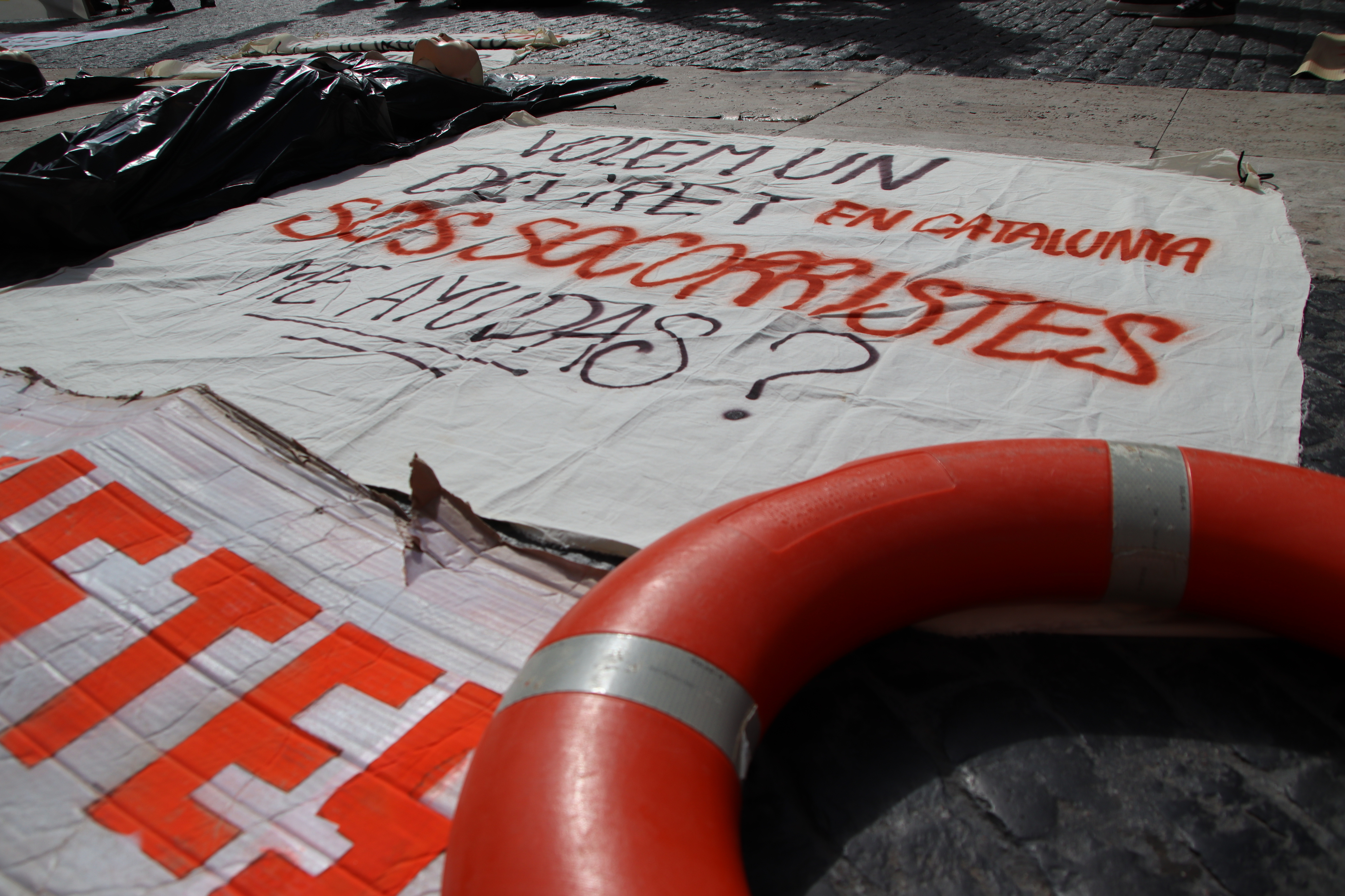 Lifeguard buoy and poster during a lifeguard protest on June 12, 2024 in Barcelona