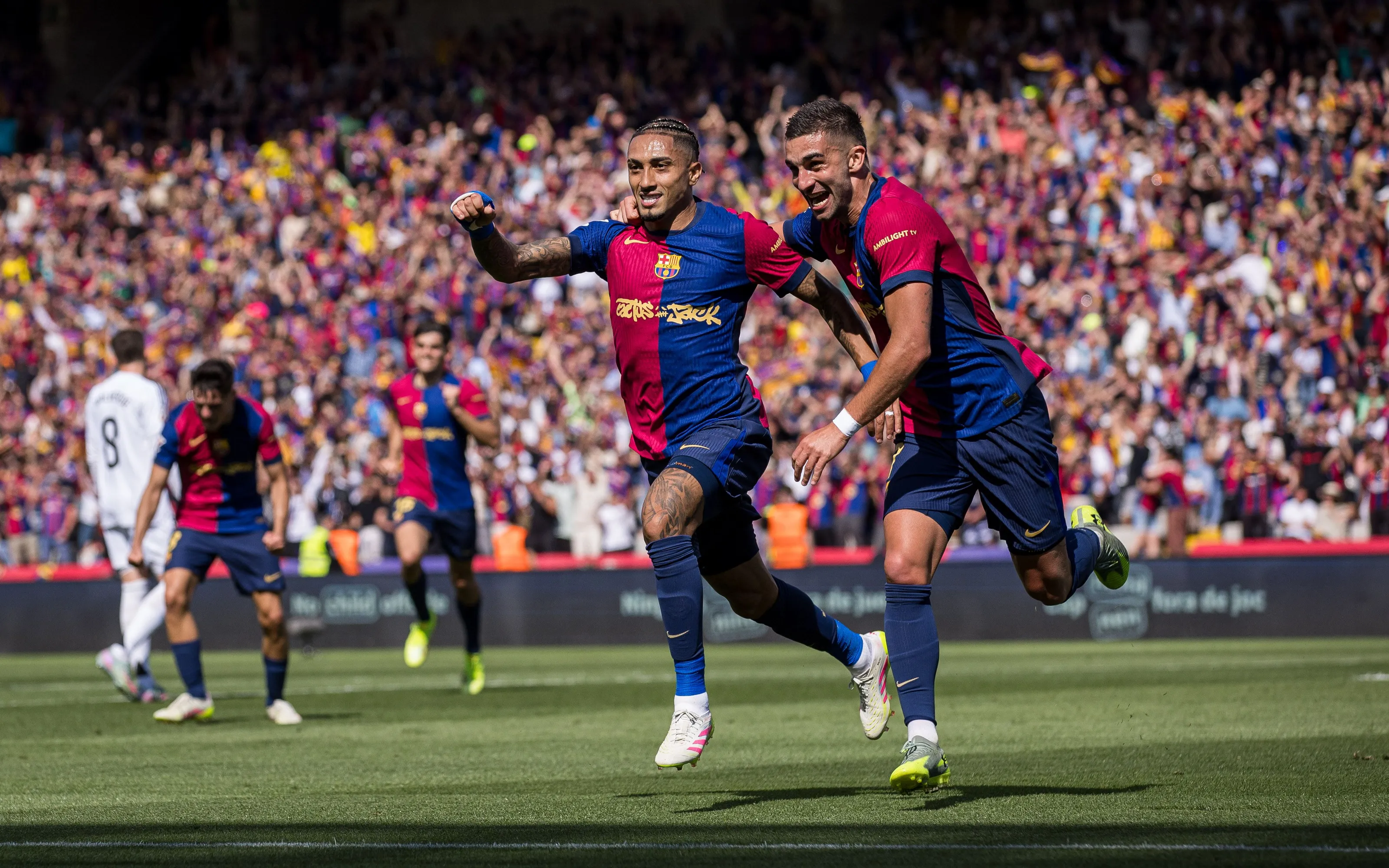 Raphinha and Ferran Torres celebrate a goal in FC Barcelona's clásico victory over Real Madrid