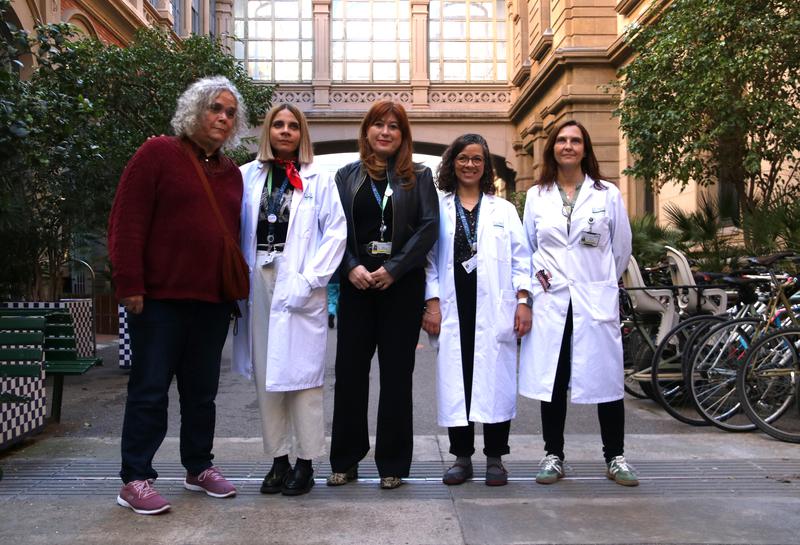 Noa, a trans patient at the Hospital Clínic (left), with medical staff from the center involved in writing the 'Guide to Transgender Care in Healthcare Settings'