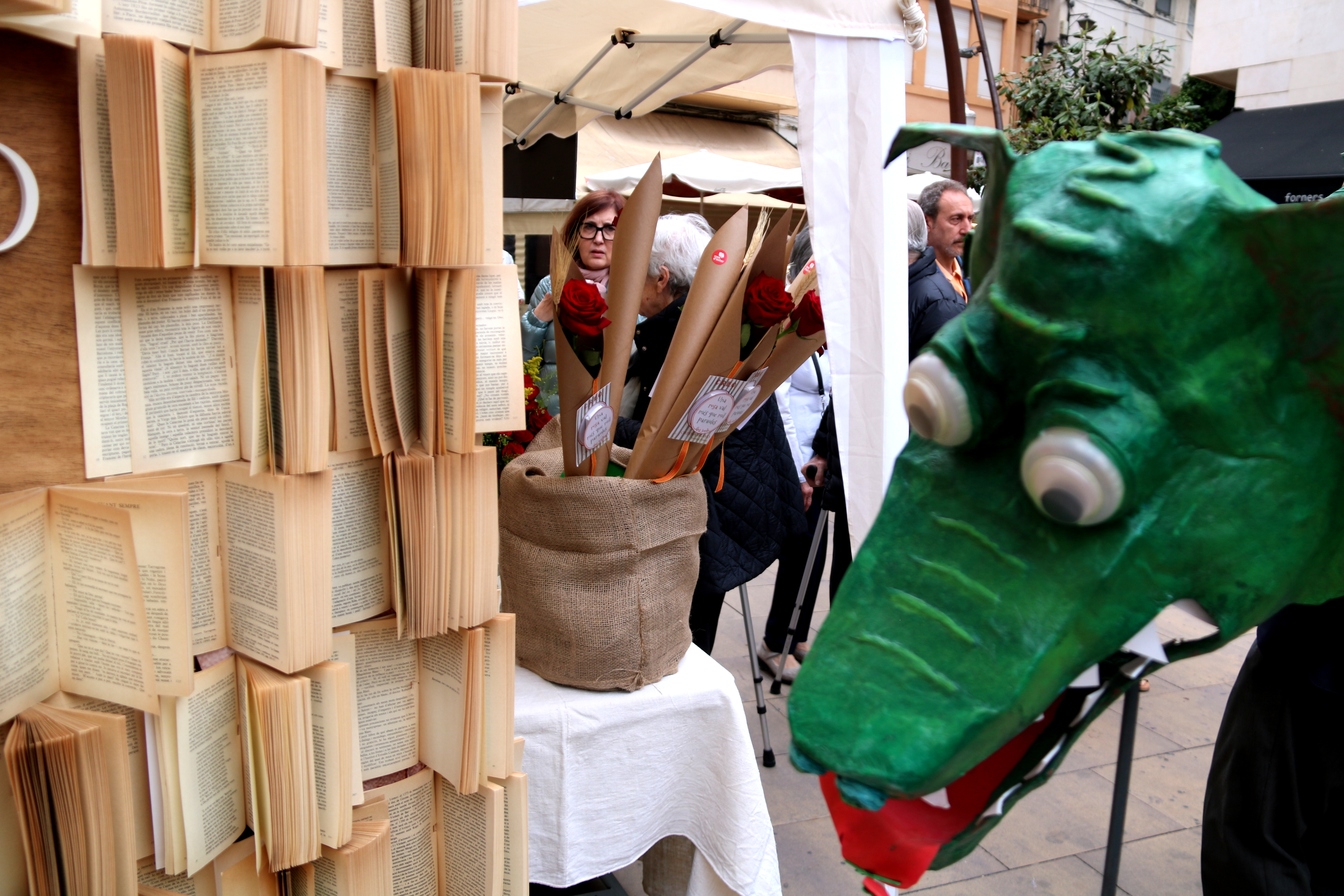 Books, roses and a dragon at one of the stalls in Tortosa on Sant Jordi