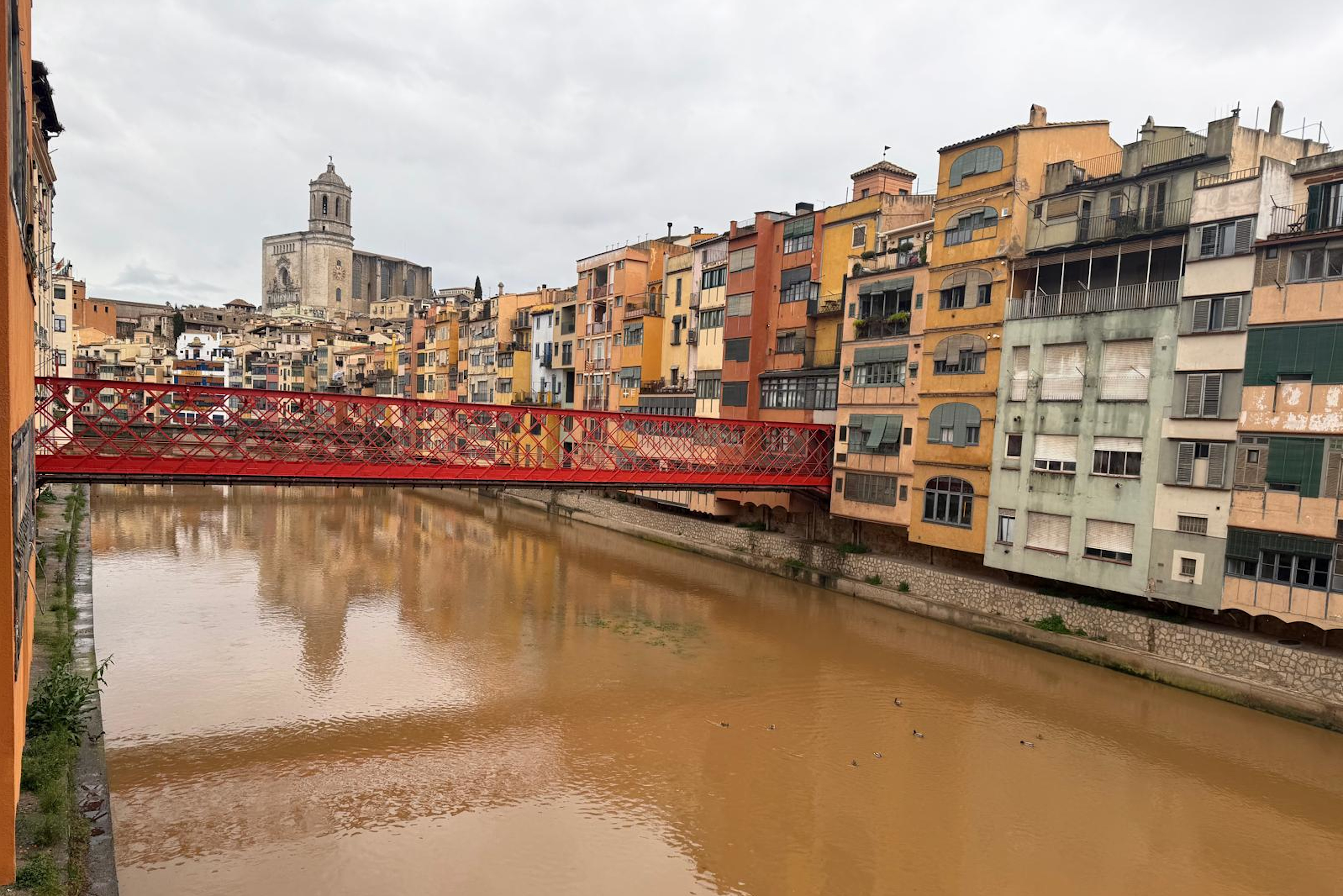 The Onyar river crosses through the center of Girona with a higher river flow than usual on March 9, 2025