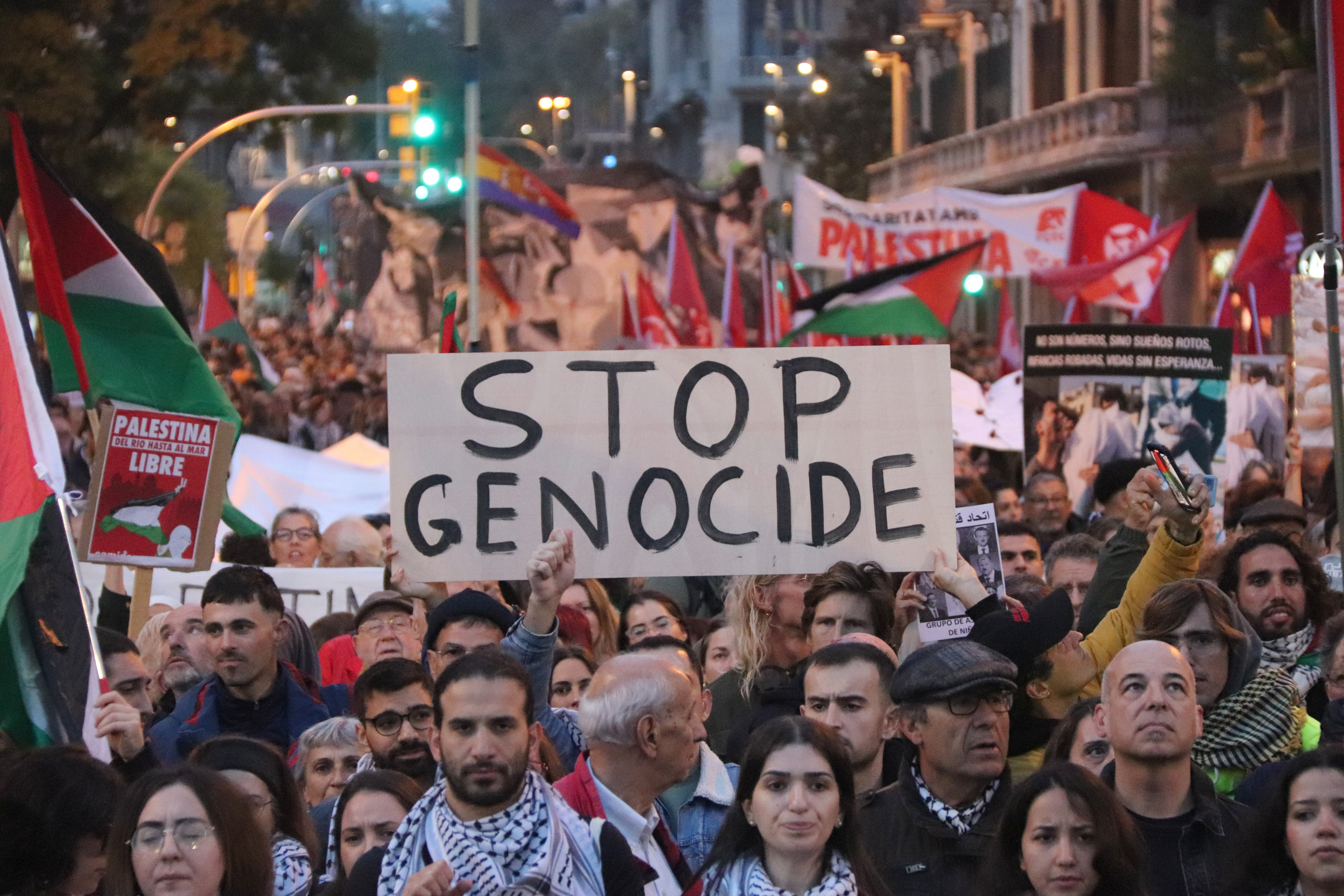 A poster reads 'Stop Genocide' during a pro-Palestine protest in Barcelona on November 11, 2023
