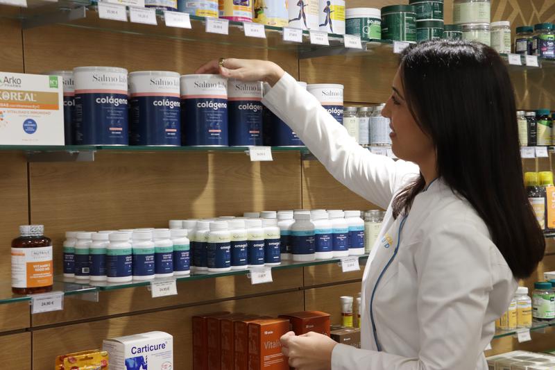 Shelves stocked with supplements in a pharmacy