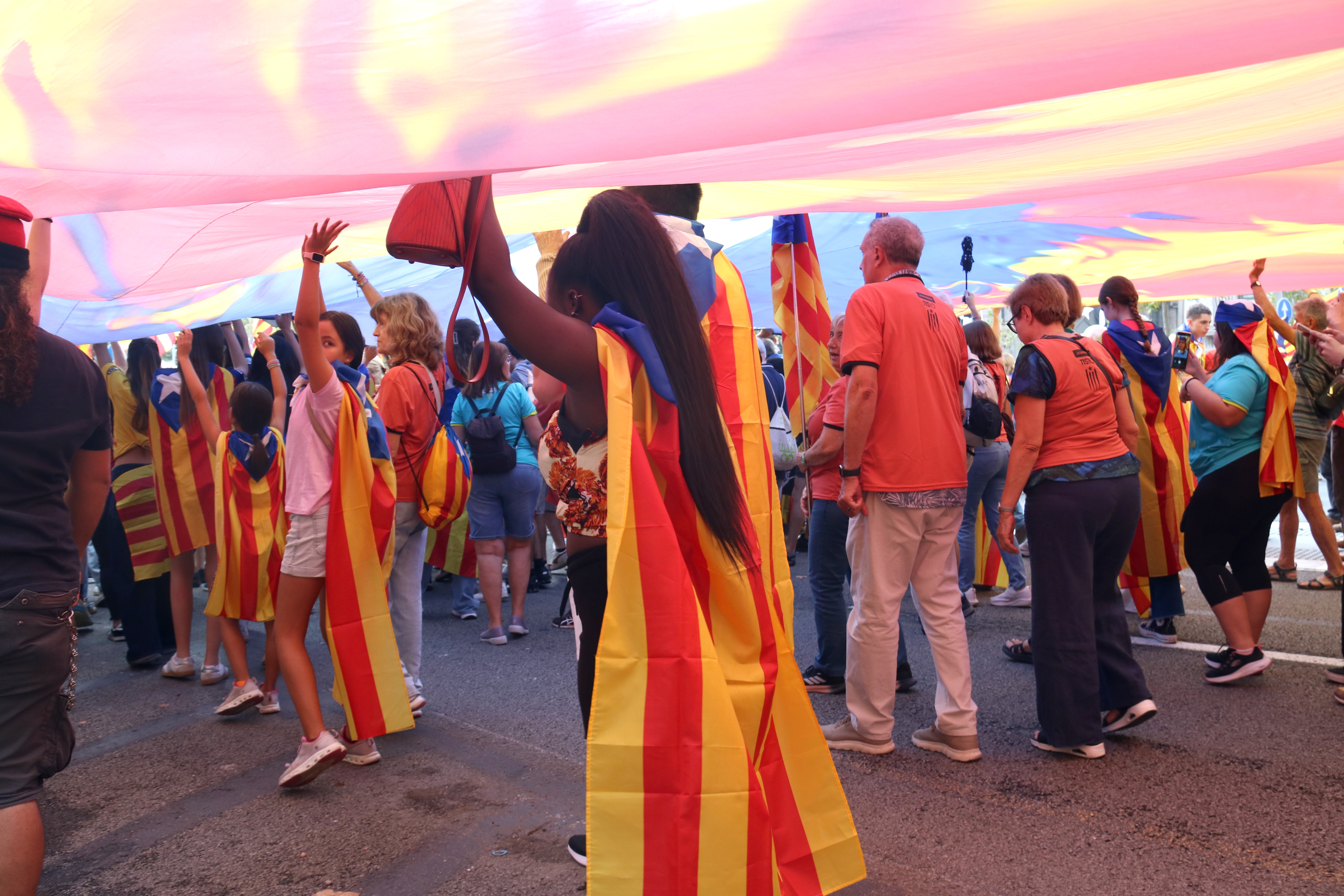 Under a giant 'estelada' pro-independence flag