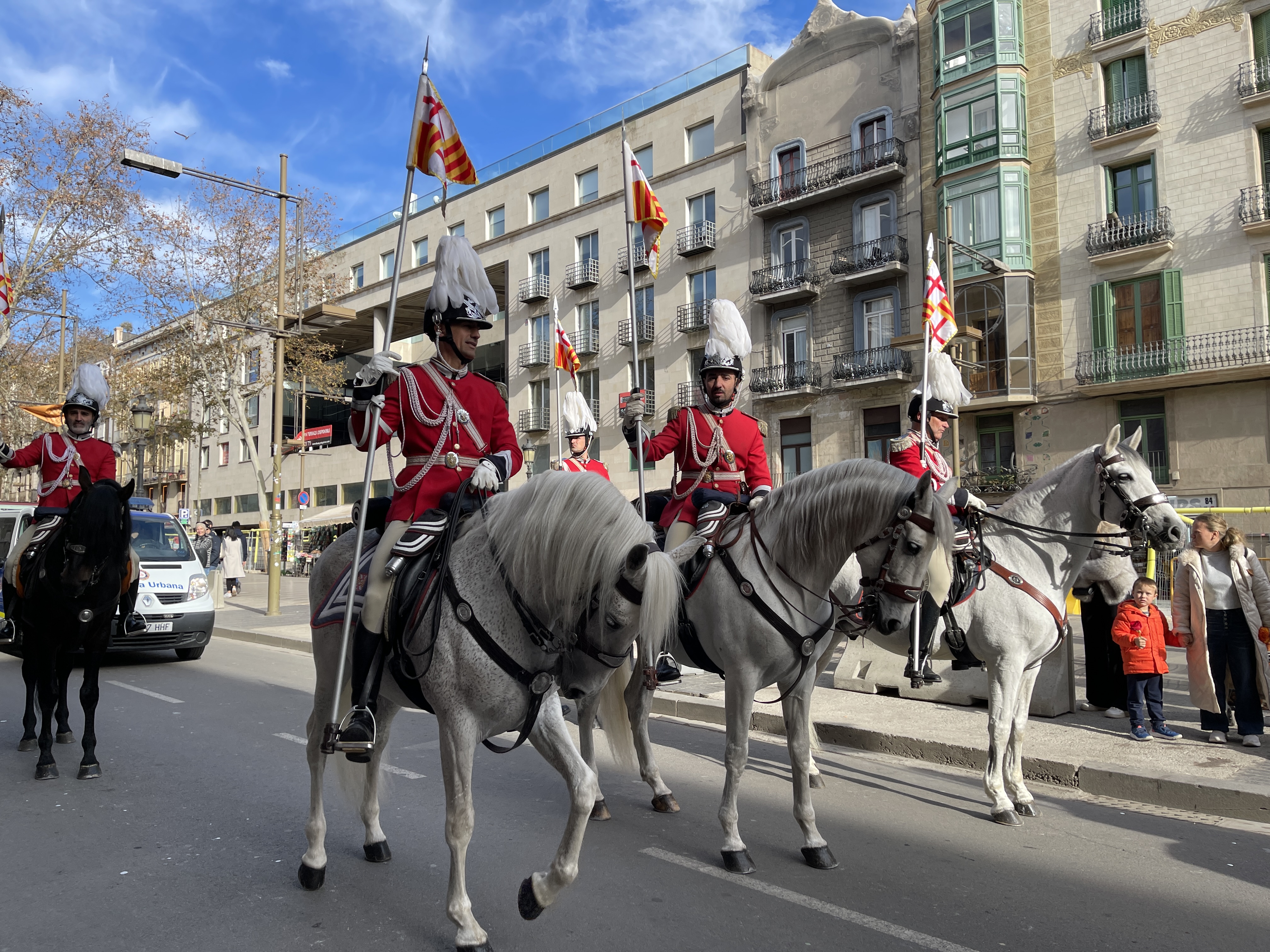 One horse is eager to set off again as the parade pauses on La Rambla