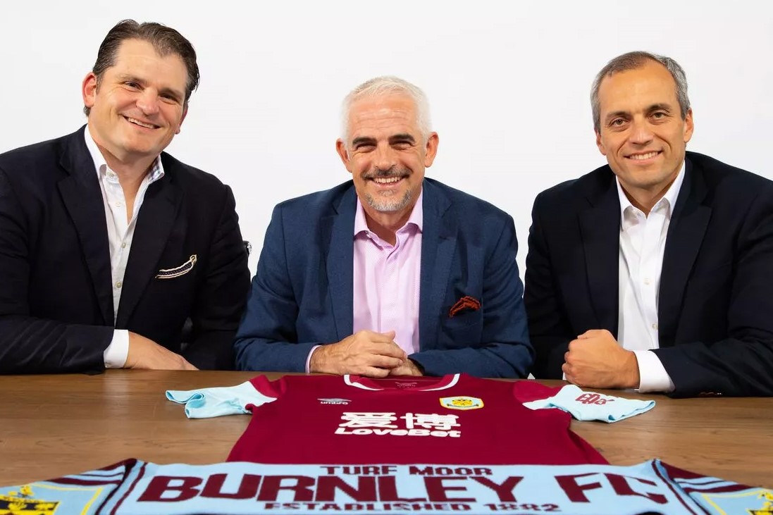 Alan Parce, member of ALK Capital and owner of Premier League's Burnley FC, poses in the middle of the photo