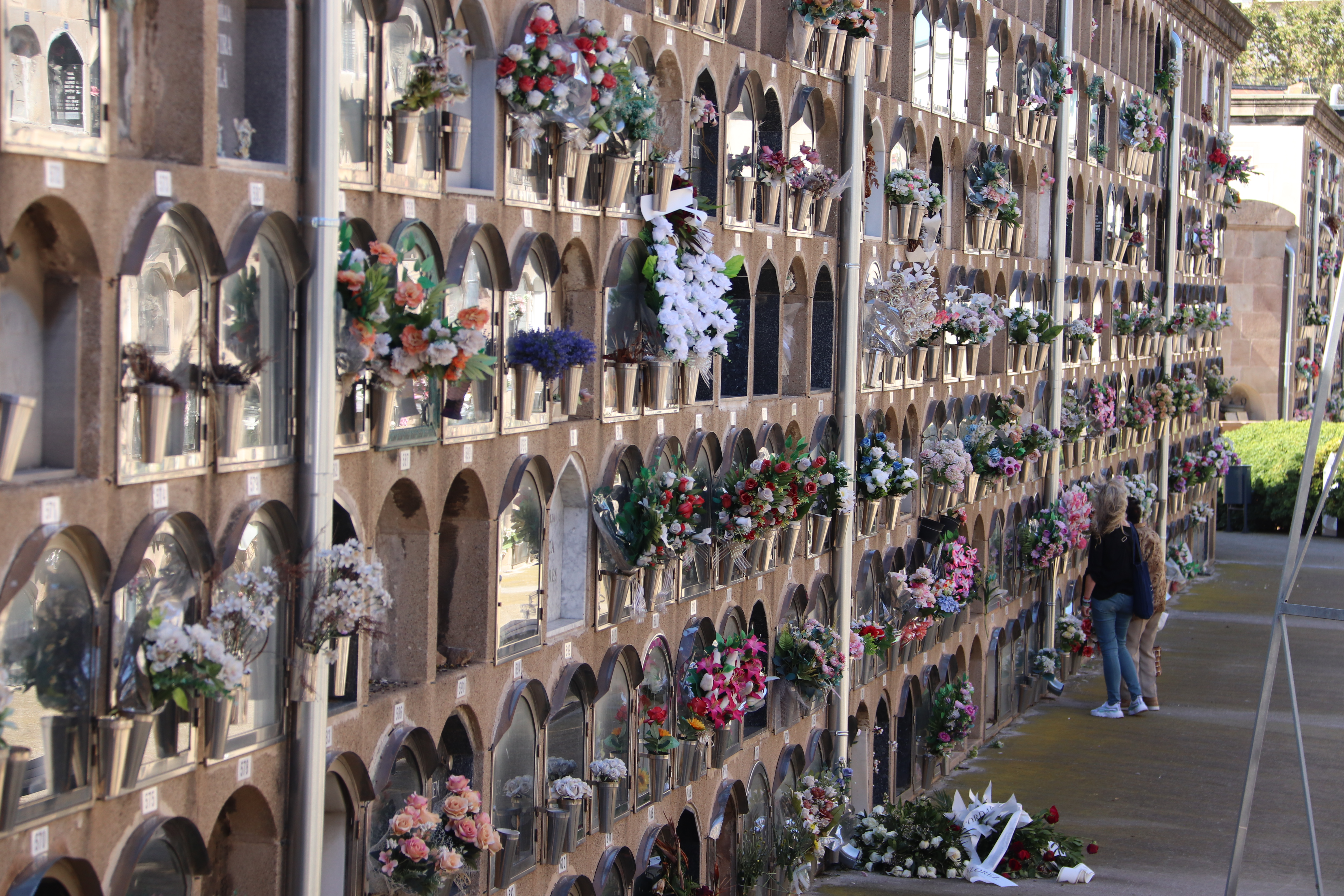 Niche tombs with flowers at Poblenou Cemetery