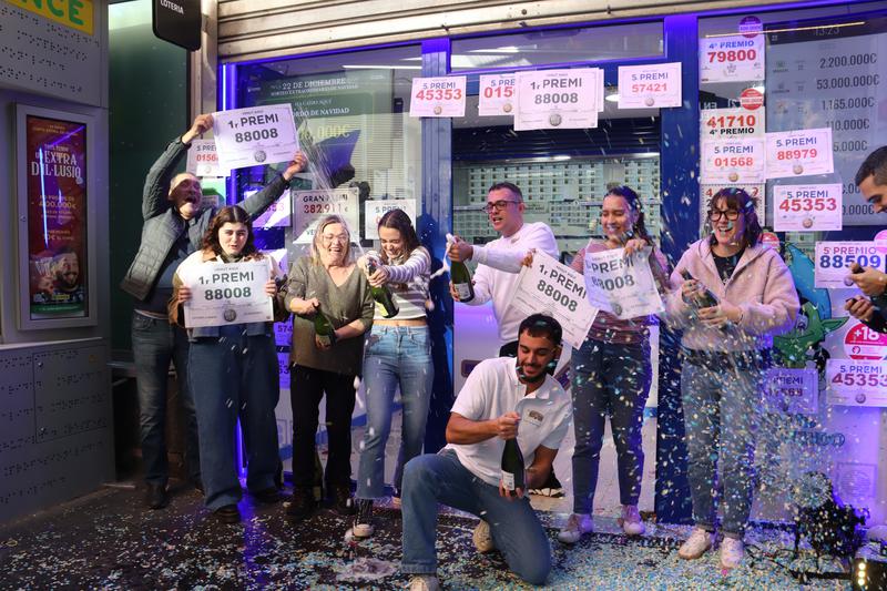 Barcelona lottery store workers celebrate winning El Gordo