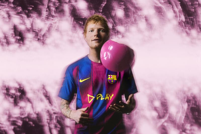 English singer-songwriter Ed Sheeran wears a special edition of the FC Barcelona jersey with his Play album logo
