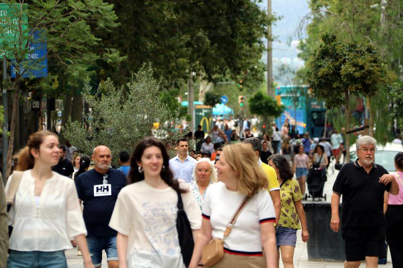 Pedestrians walking down Avinguda del Portal de l'Àngel in Barcelona